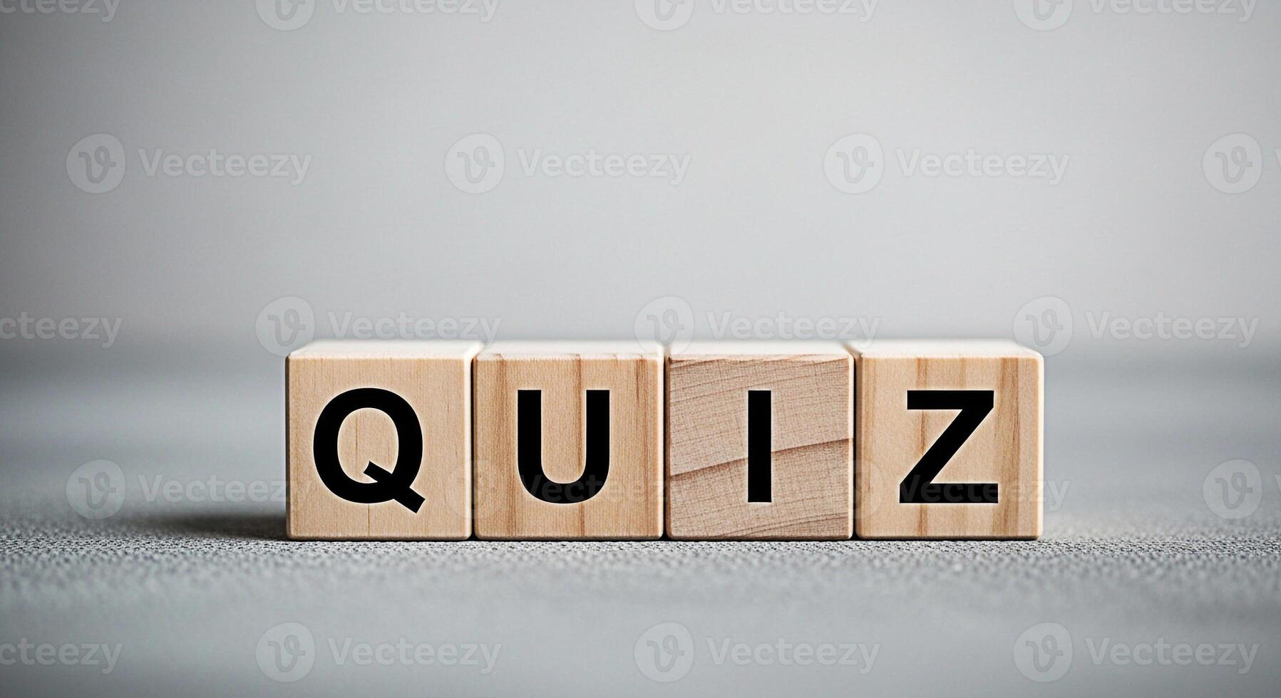 Wooden blocks spelling QUIZ on a gray surface inviting participation and testing knowledge in an educational and engaging environment promoting learning and intellectual stimulation photo