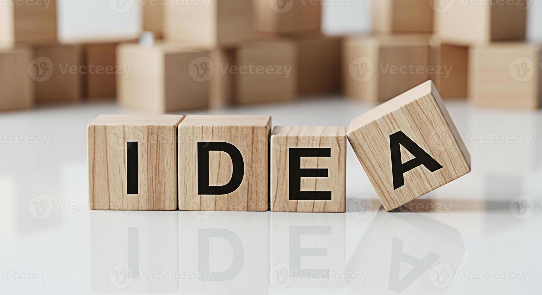 Wooden blocks spelling IDEA on a white surface symbolizing creative thinking and problemsolving in a minimalist setting conveying innovation and inspiration for business and personal growth photo