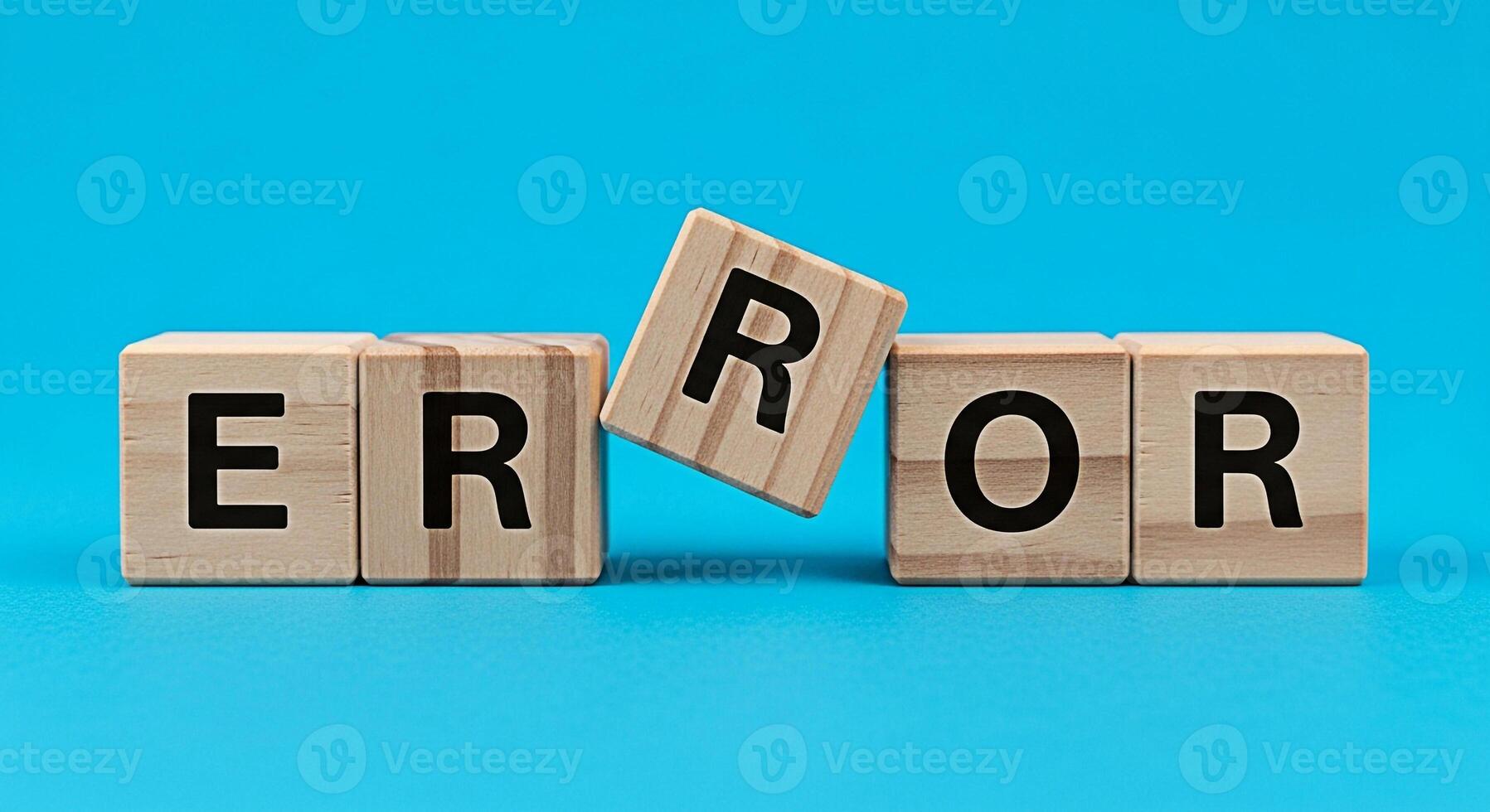Wooden blocks spelling ERROR on a blue background symbolizing a system failure or programming bug creating a sense of frustration and the need for troubleshooting in a techfocused environment photo