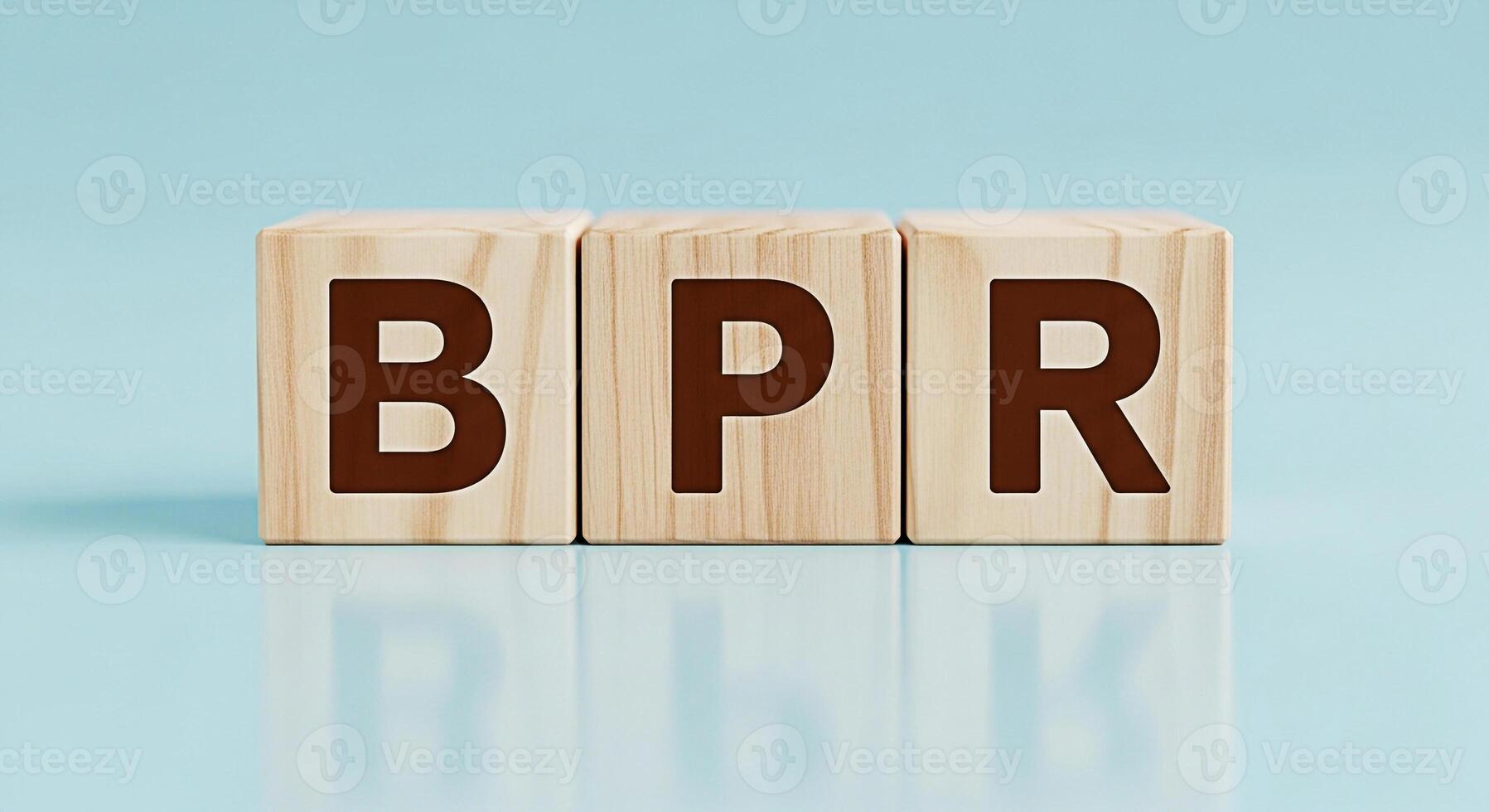 Wooden blocks displaying the letters BPR on a light blue surface representing Business Process Reengineering in a clean and minimalist environment symbolizing efficiency and optimization photo