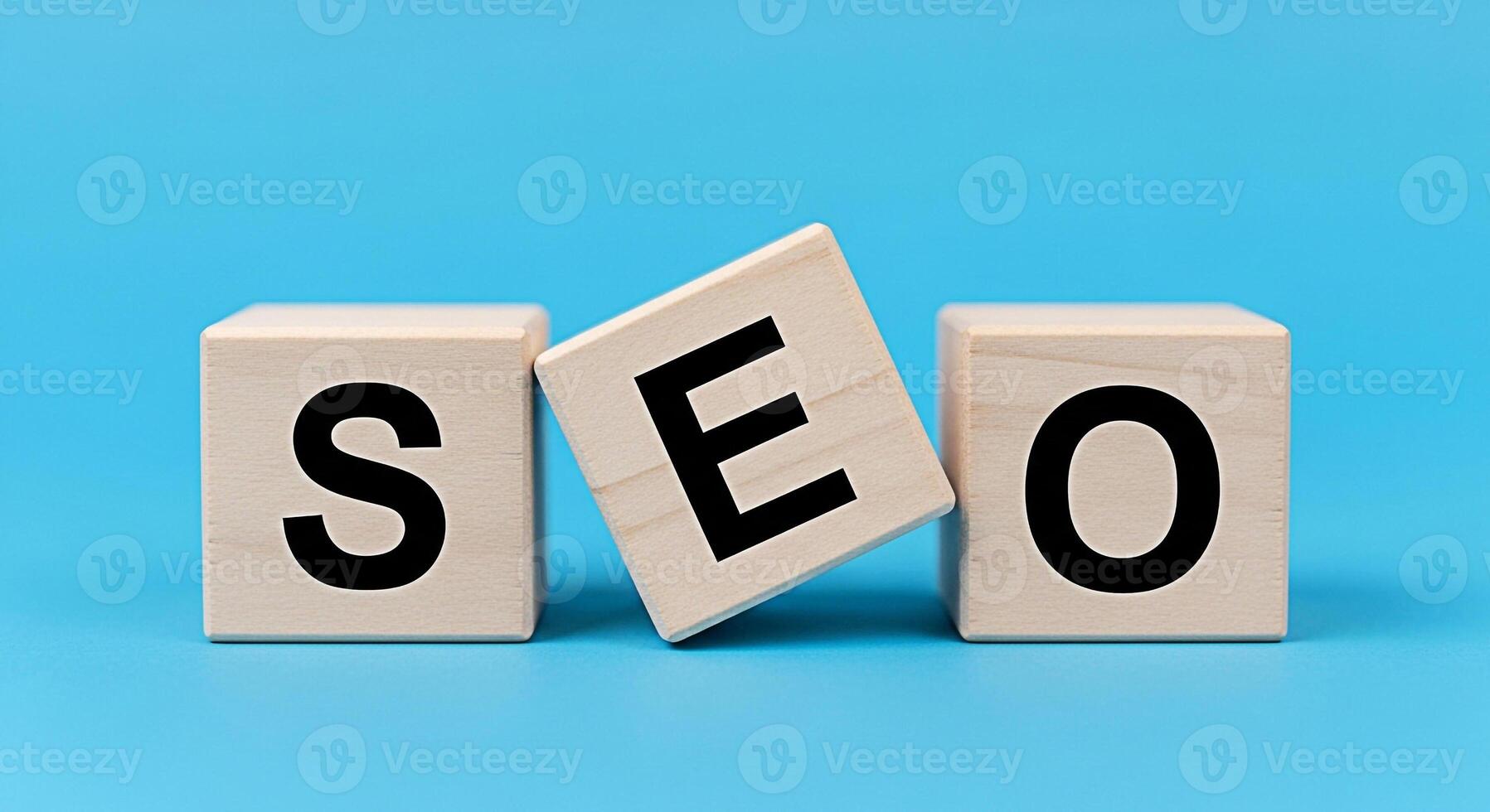 Wooden blocks spelling SEO on a blue background representing search engine optimization strategies and digital marketing techniques for online business growth and improved website ranking photo