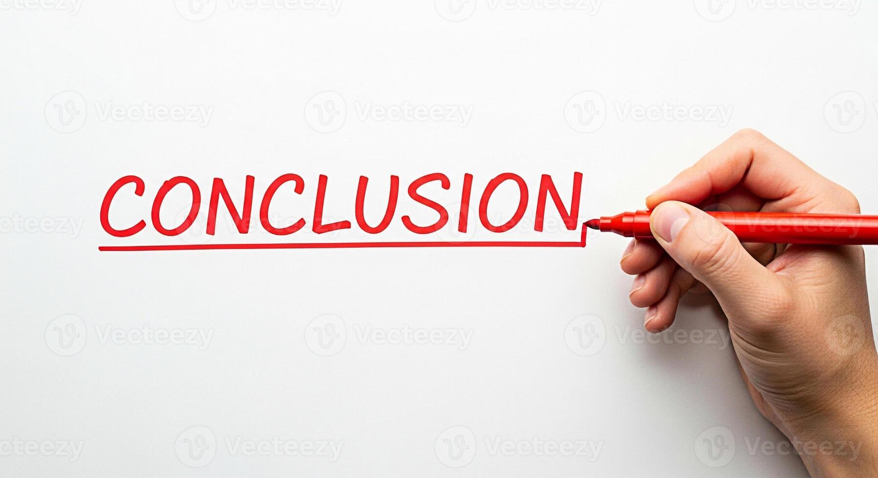 Hand writing the word Conclusion with a red marker on a white surface symbolizing the final step and the end of a process conveying a sense of completion and resolution in a clean minimalist setting photo