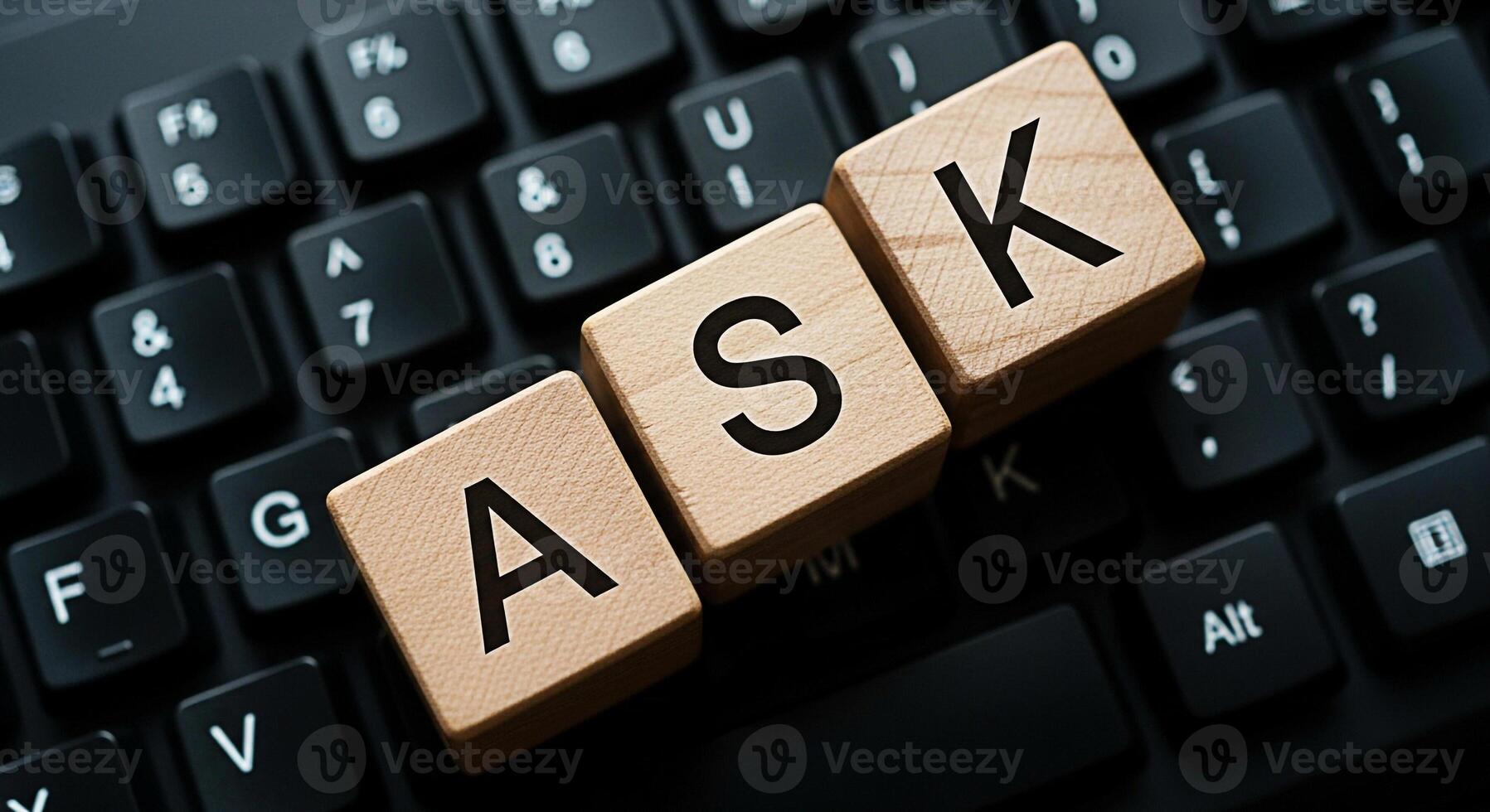 Wooden blocks spelling ASK resting on a black computer keyboard symbolizing information seeking and problemsolving in a modern digital environment fostering curiosity and knowledge acquisition photo
