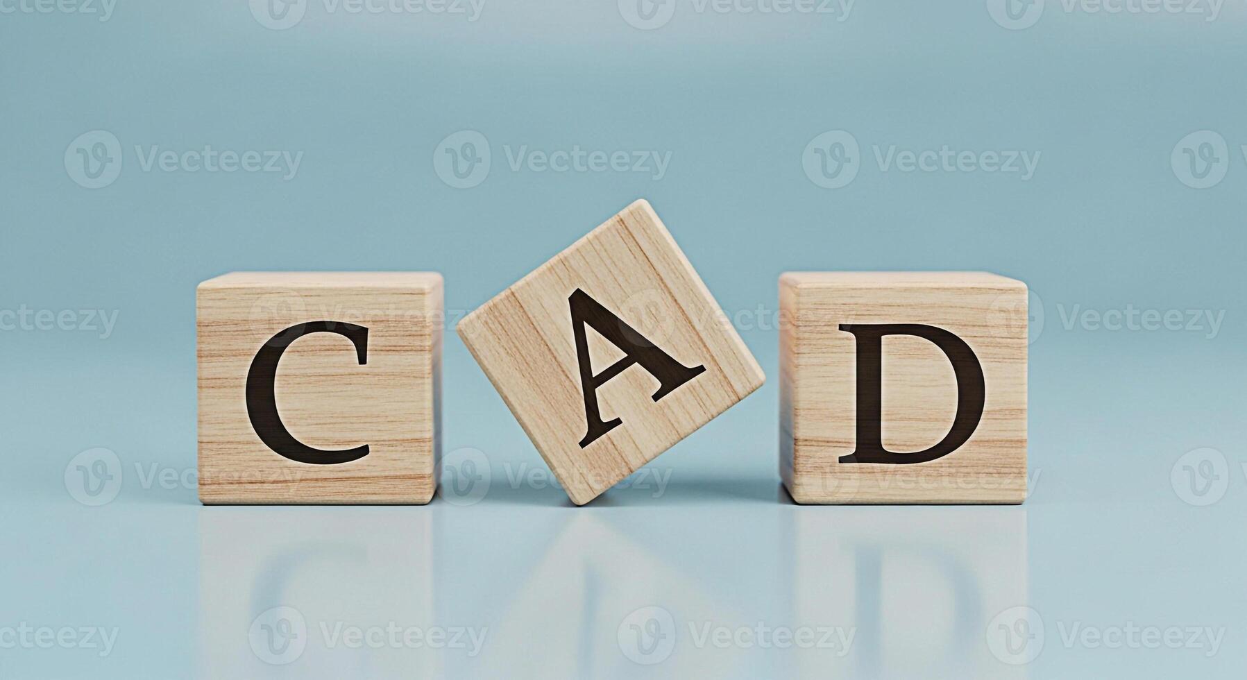 Three wooden blocks displaying the letters CAD on a light blue surface representing computeraided design and the importance of precision and innovation in modern engineering and architectural design p photo
