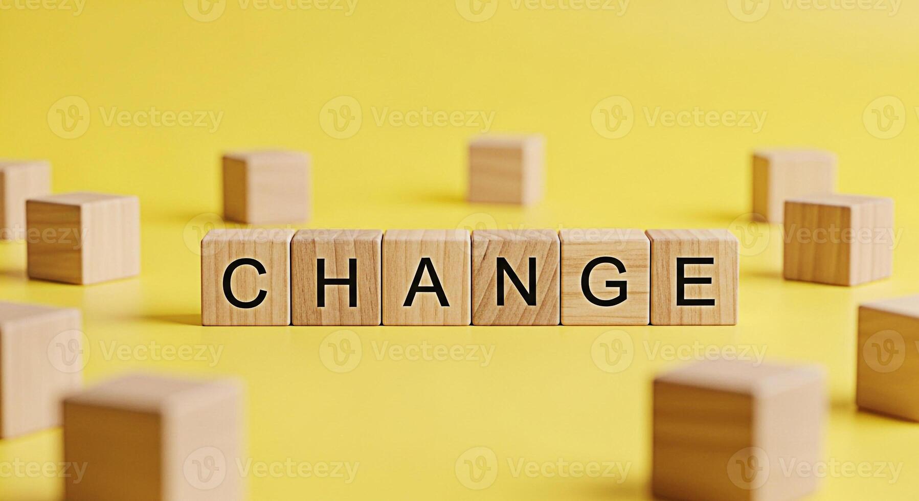 Wooden blocks spelling CHANGE on a yellow surface symbolizing transformation and adaptation in a bright optimistic setting representing opportunity and growth for business and personal development photo