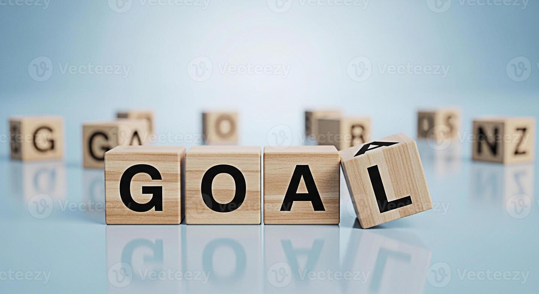 Wooden blocks spelling GOAL on a reflective surface symbolizing achievement and aspiration in a bright minimalist setting representing focus and determination for success photo