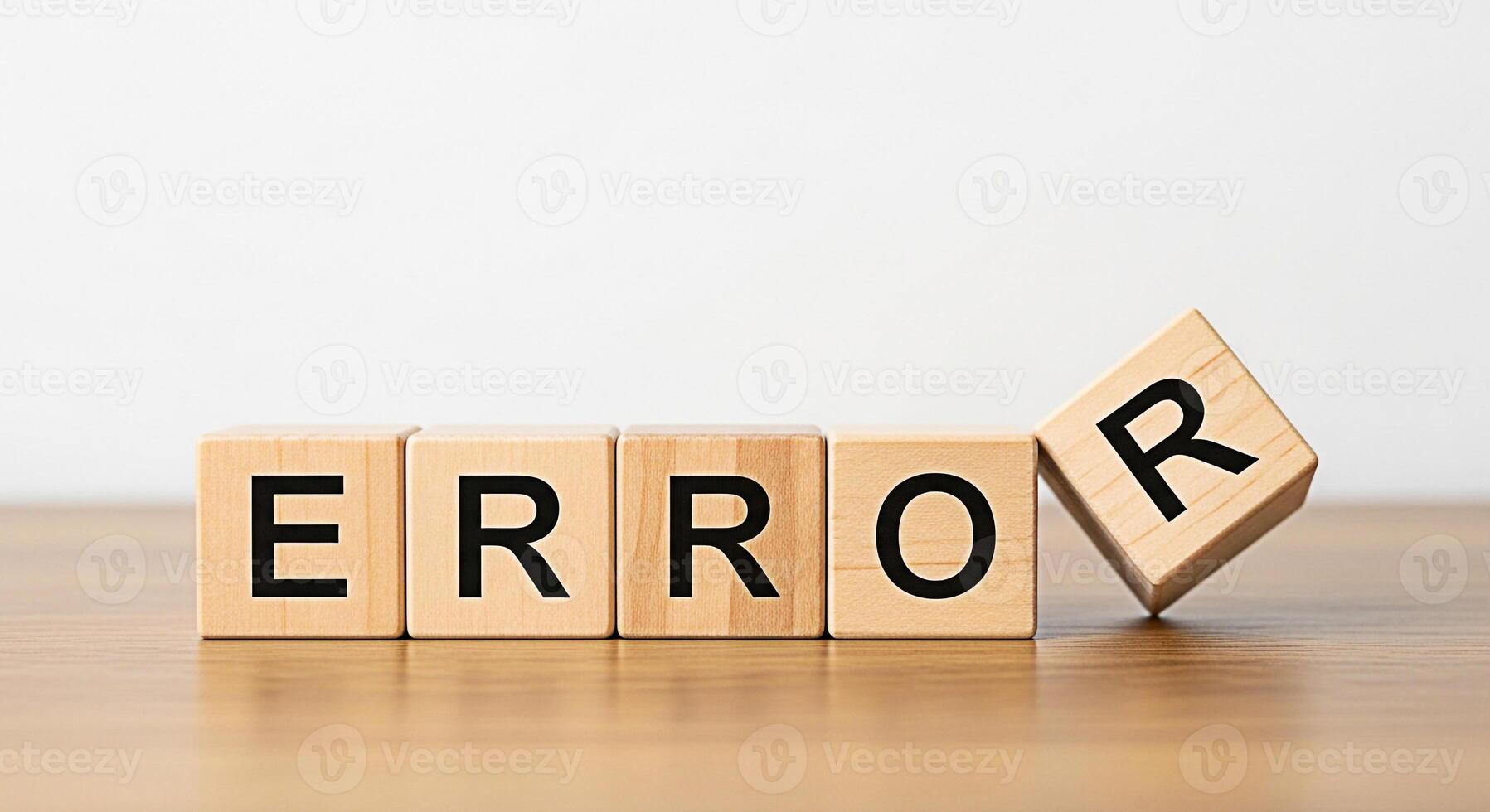 Wooden blocks spelling ERROR with one block falling on a bright surface symbolizing system failure mistake or problem in a clean minimalist environment conveying a sense of urgency and the need for tr photo