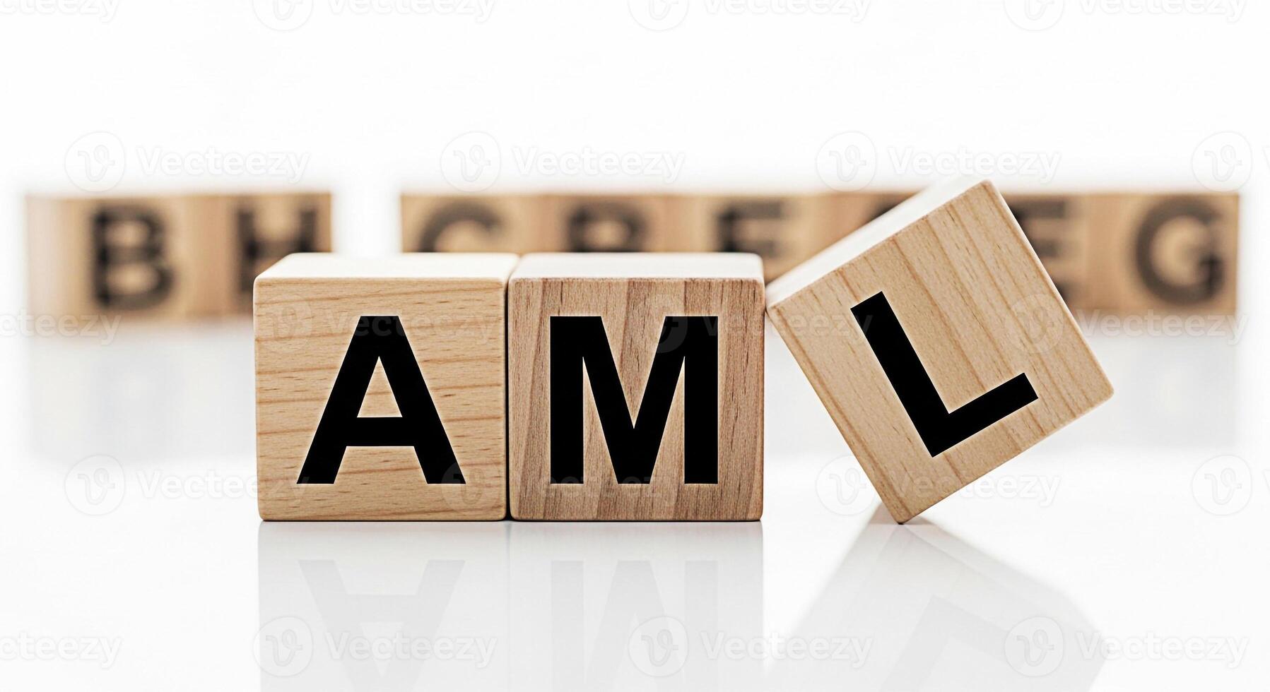 Wooden blocks spelling AML on a reflective white surface representing AntiMoney Laundering compliance and regulatory framework conveying a sense of financial security and transparency in a clean minim photo
