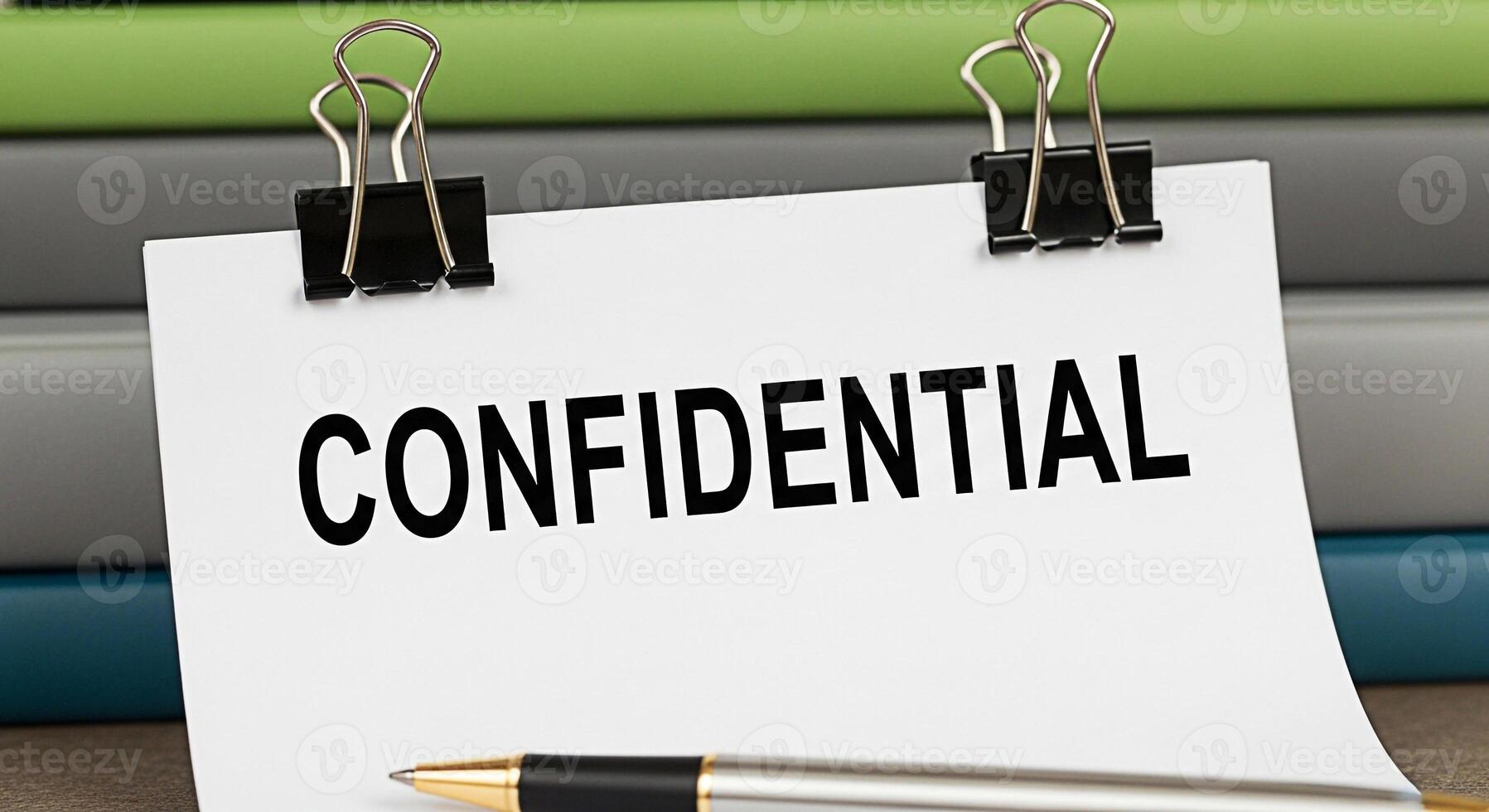 Closeup of a confidential document secured with binder clips on a desk emphasizing the importance of privacy and discretion in a professional office environment creating a mood of seriousness and secu photo