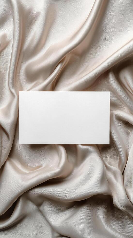 Blank Card on Soft Gray Fabric With Smooth Texture, Focusing on Simplicity and Elegance photo