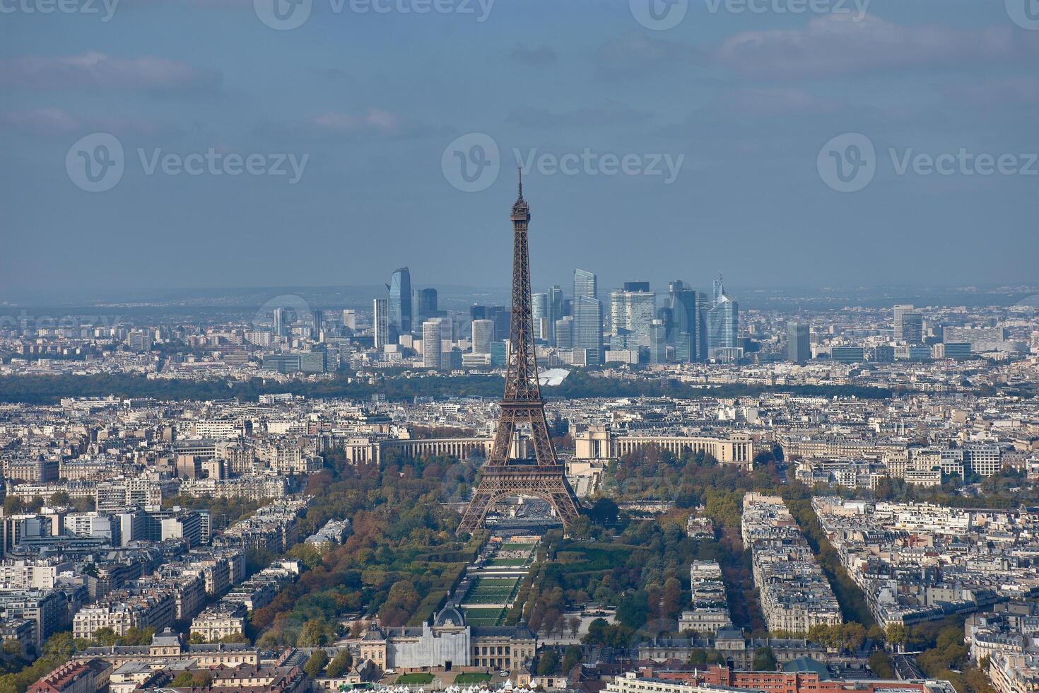 Panoramic view of Paris with the Eiffel Tower in the foreground and the La Defense district in the background from the Montparnasse Tower photo