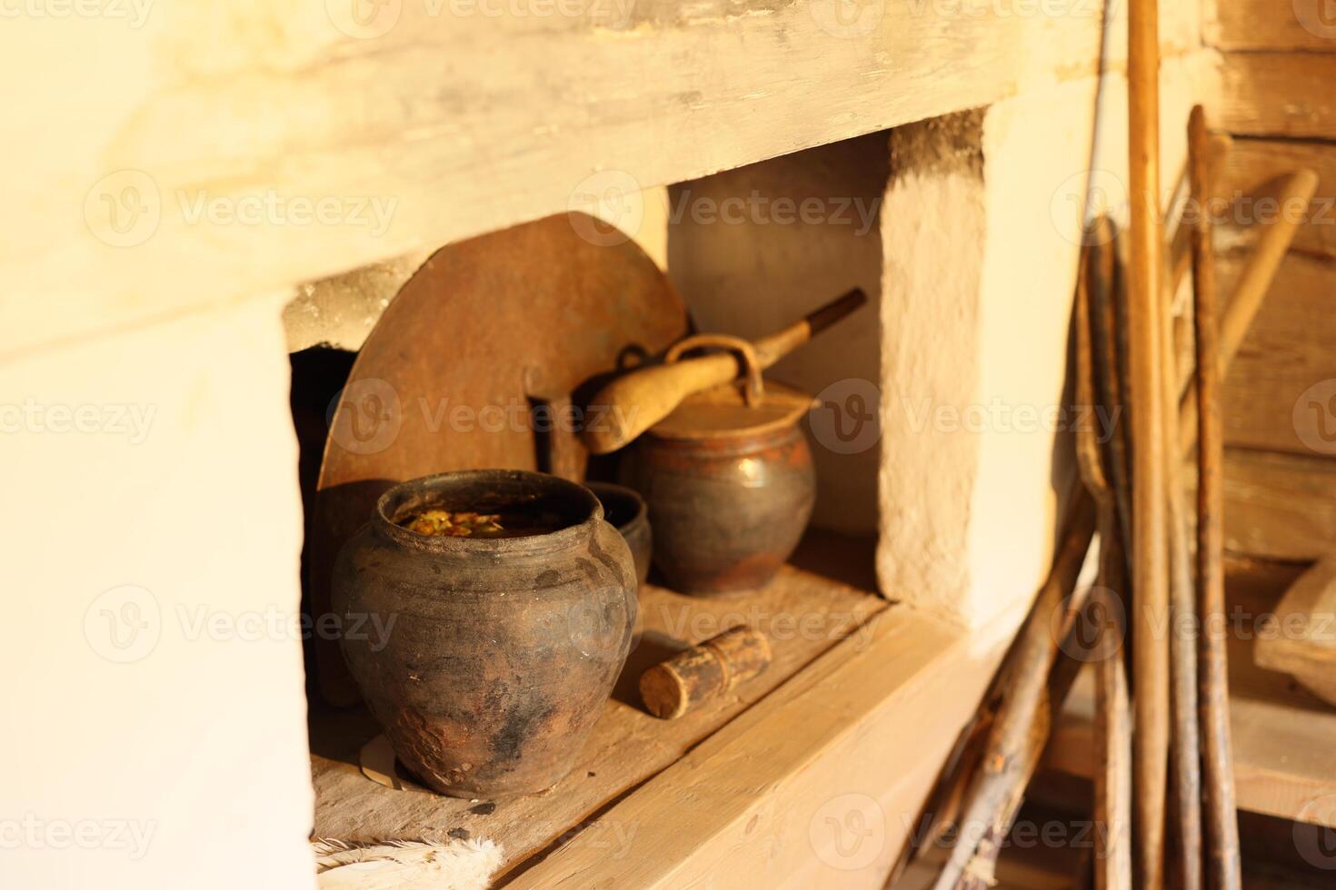 Exploring Traditional Kitchen Tools and Pottery Within a Charming Rustic Setting photo