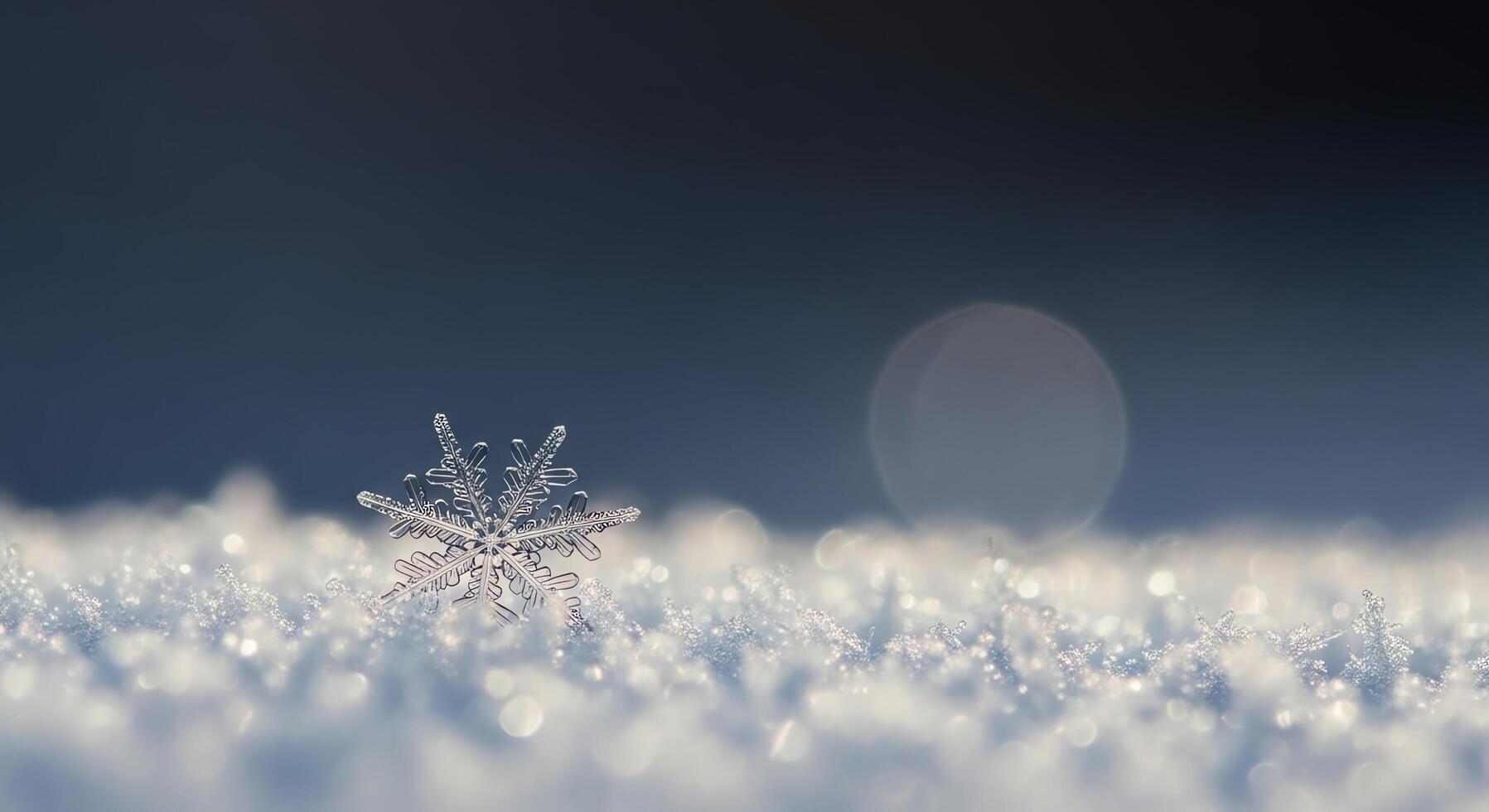 A close-up macro photograph of a glacial snowflake resting on a field of soft snow with bokeh background photo