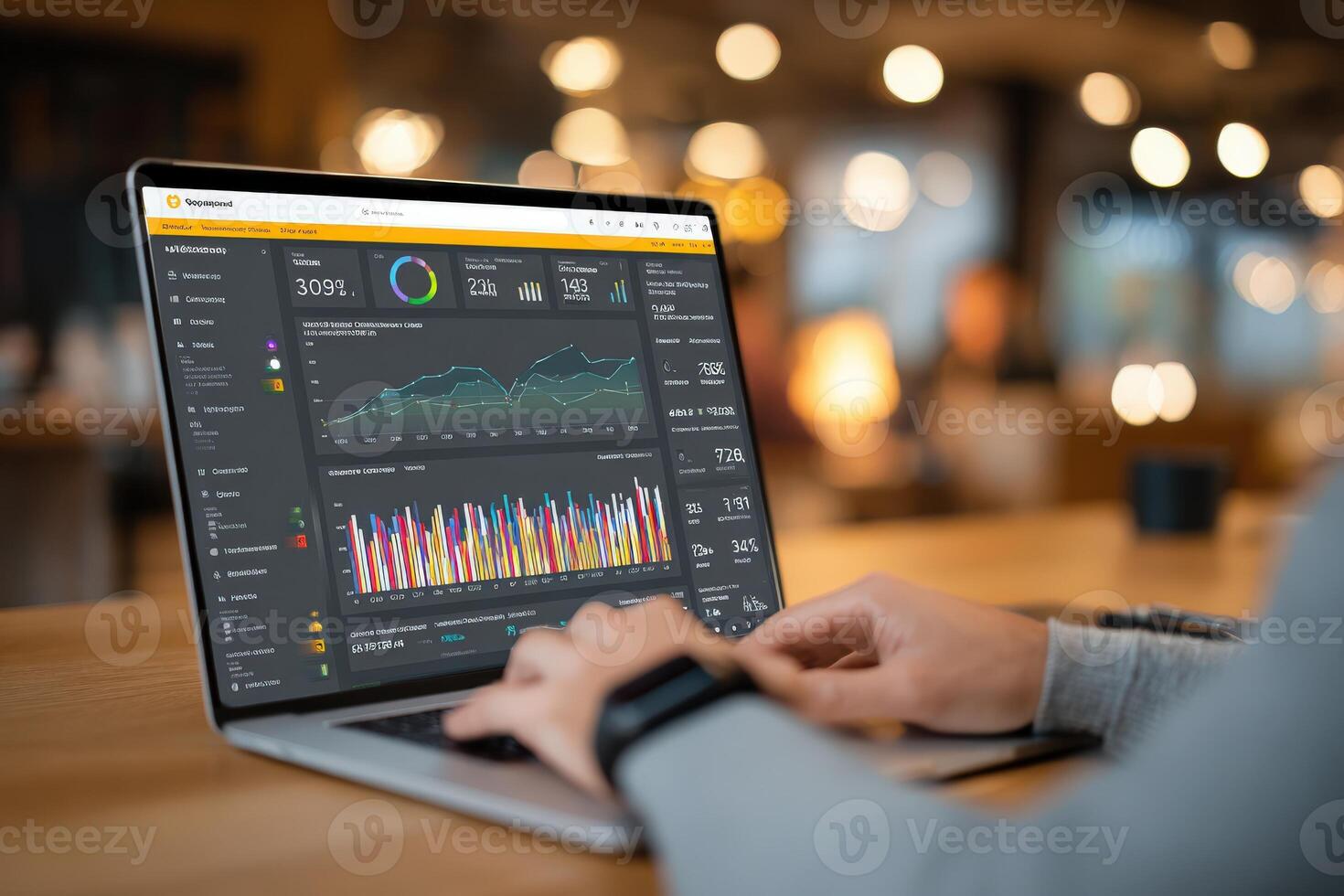 Laptop displaying data analytics dashboard with colorful graphs and charts, showcasing business performance metrics in a modern workspace environment with soft lighting photo