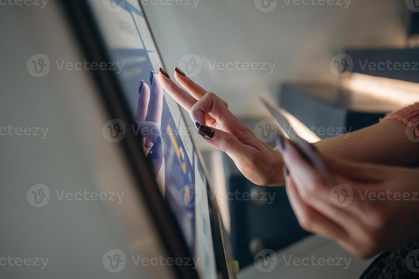 User using touchscreen payment interface photo