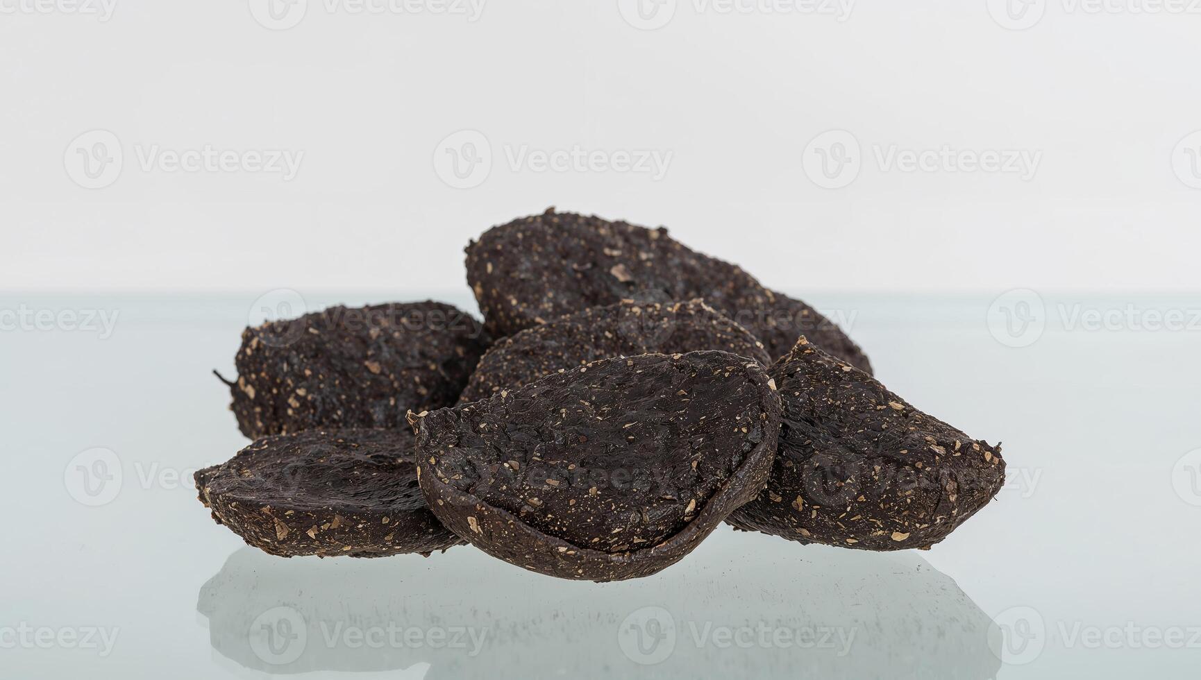 Dark Slices Composition Angular Shapes and Granular Textures on Reflective Surface. photo