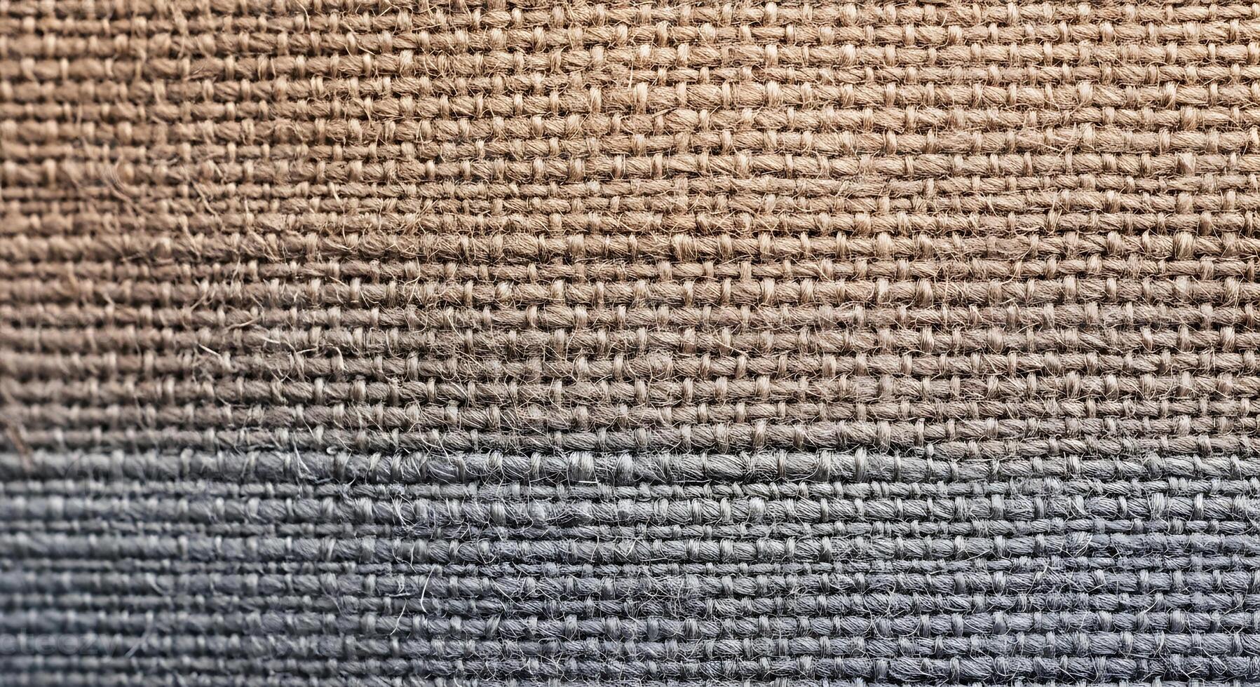 Close up textured fabric surface with gradient color transition from warm tan to cool blue photo