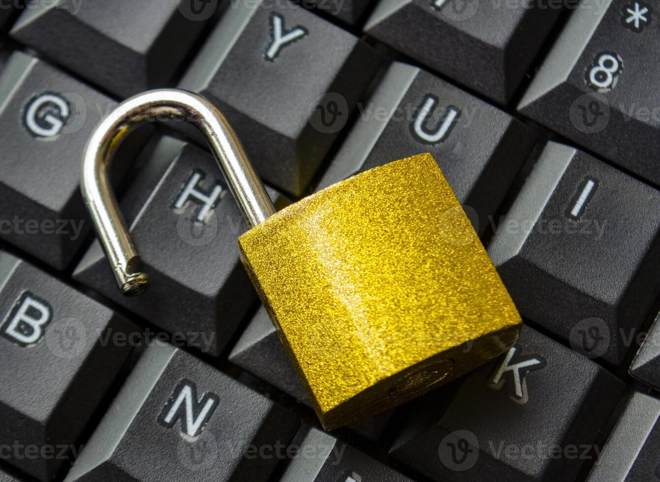 Top view of padlock on keyboard background symbolizing restricted entry, secure login or digital safety system. photo