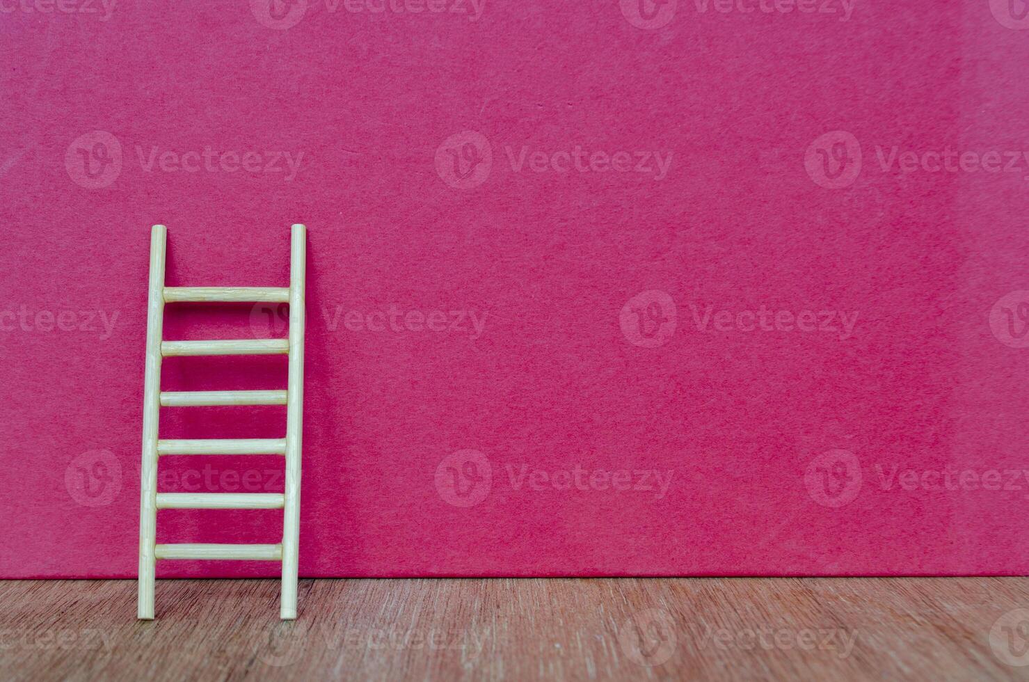 Ladder representing hard work on dark red cover background with customizable space for text. photo
