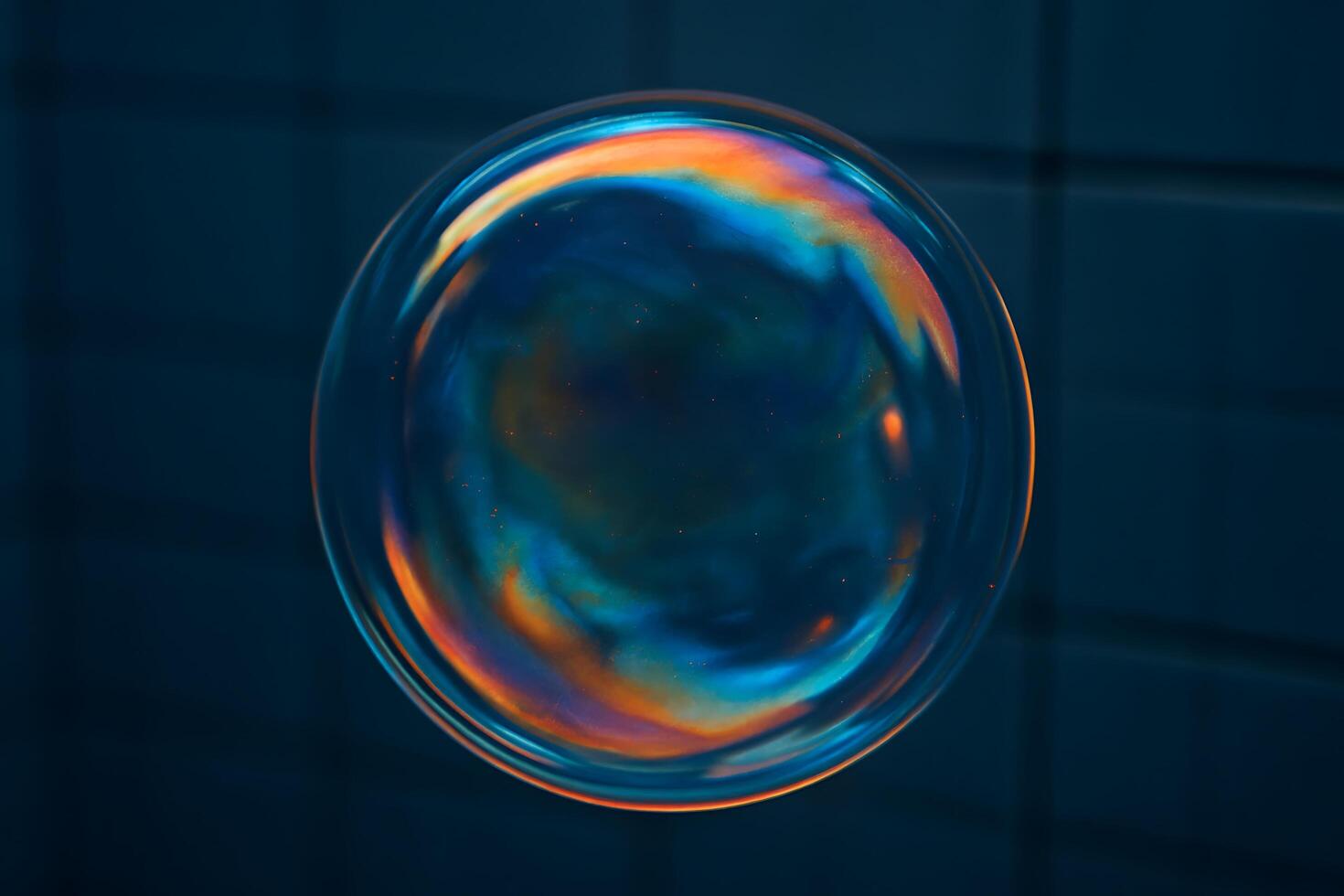 Iridescent sphere with colorful swirls against a dark background - Generated using AI photo