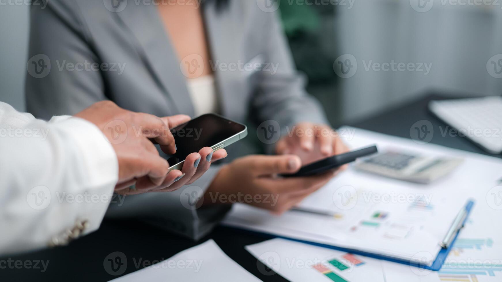 Business team using smartphone to share data and discuss project, mobile communication and digital collaboration concept photo