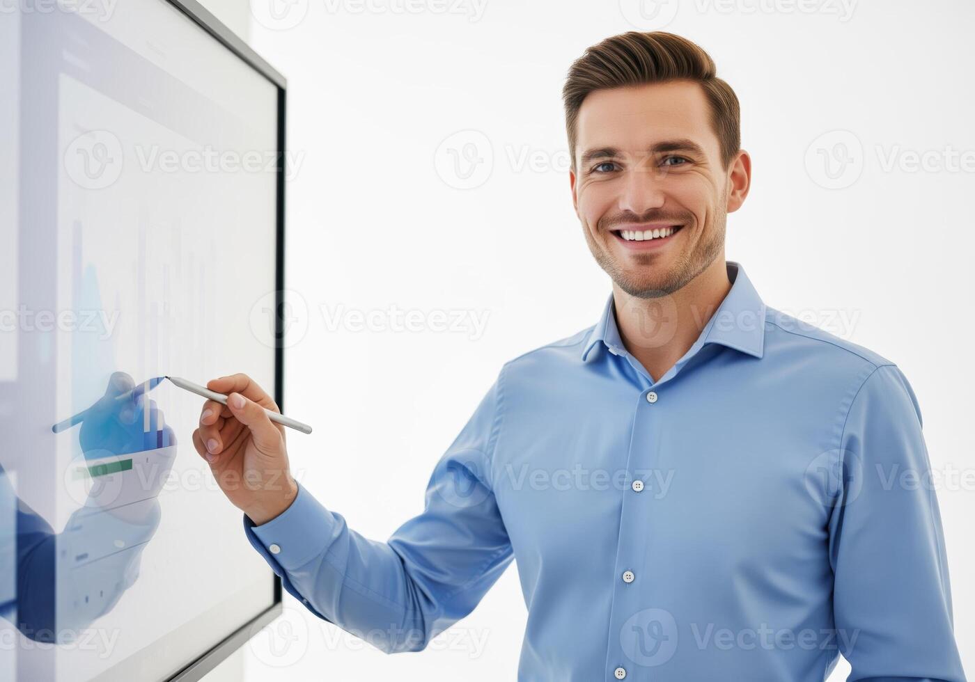 Confident professional man pointing at a business graph displayed on a modern interactive whiteboard. photo