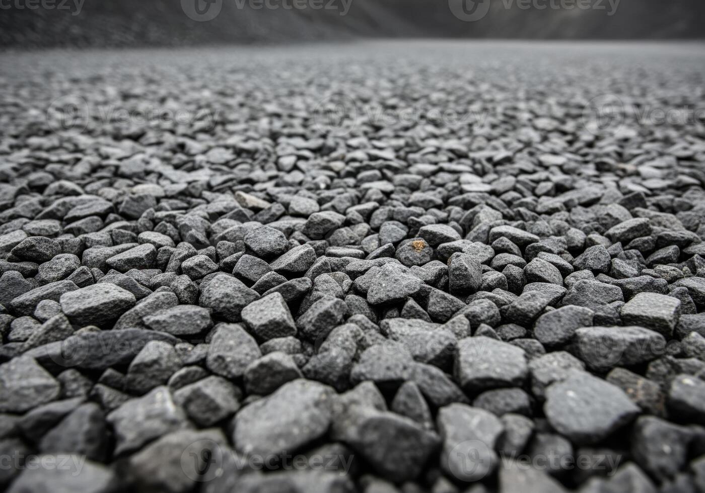 Detailed texture of dark gray angular gravel aggregate surface background material. photo
