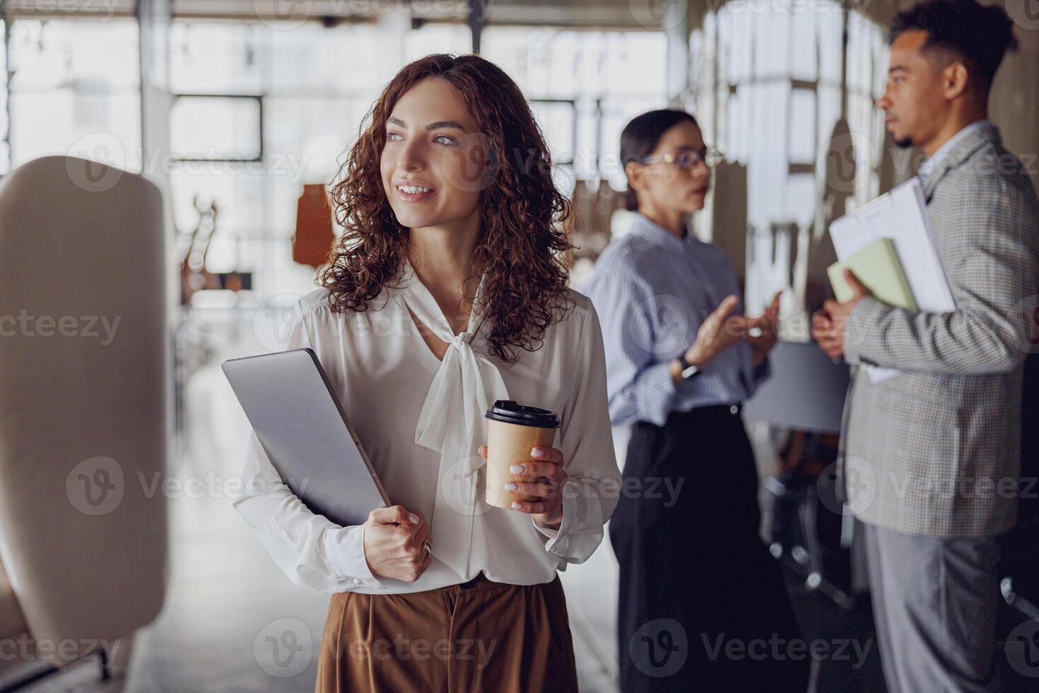 Engaging in Professional Networking Activities Within a Modern Office Environment Setting photo