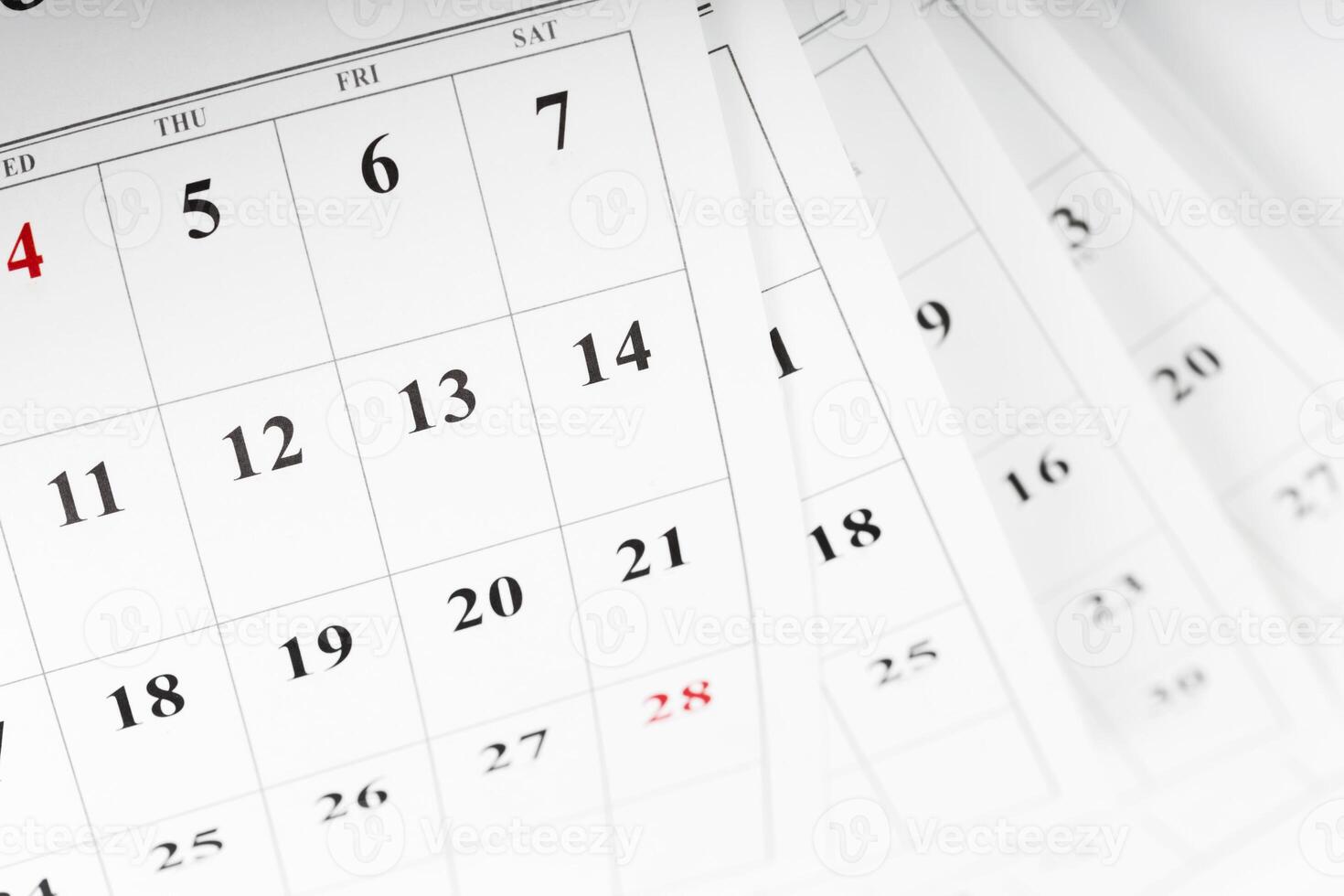 Calendar pages showing the month with highlighted dates for planning and scheduling activities photo