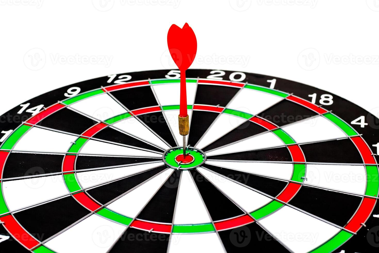 Dart hits bullseye in a game of skill symbolizing success and precise targeting photo