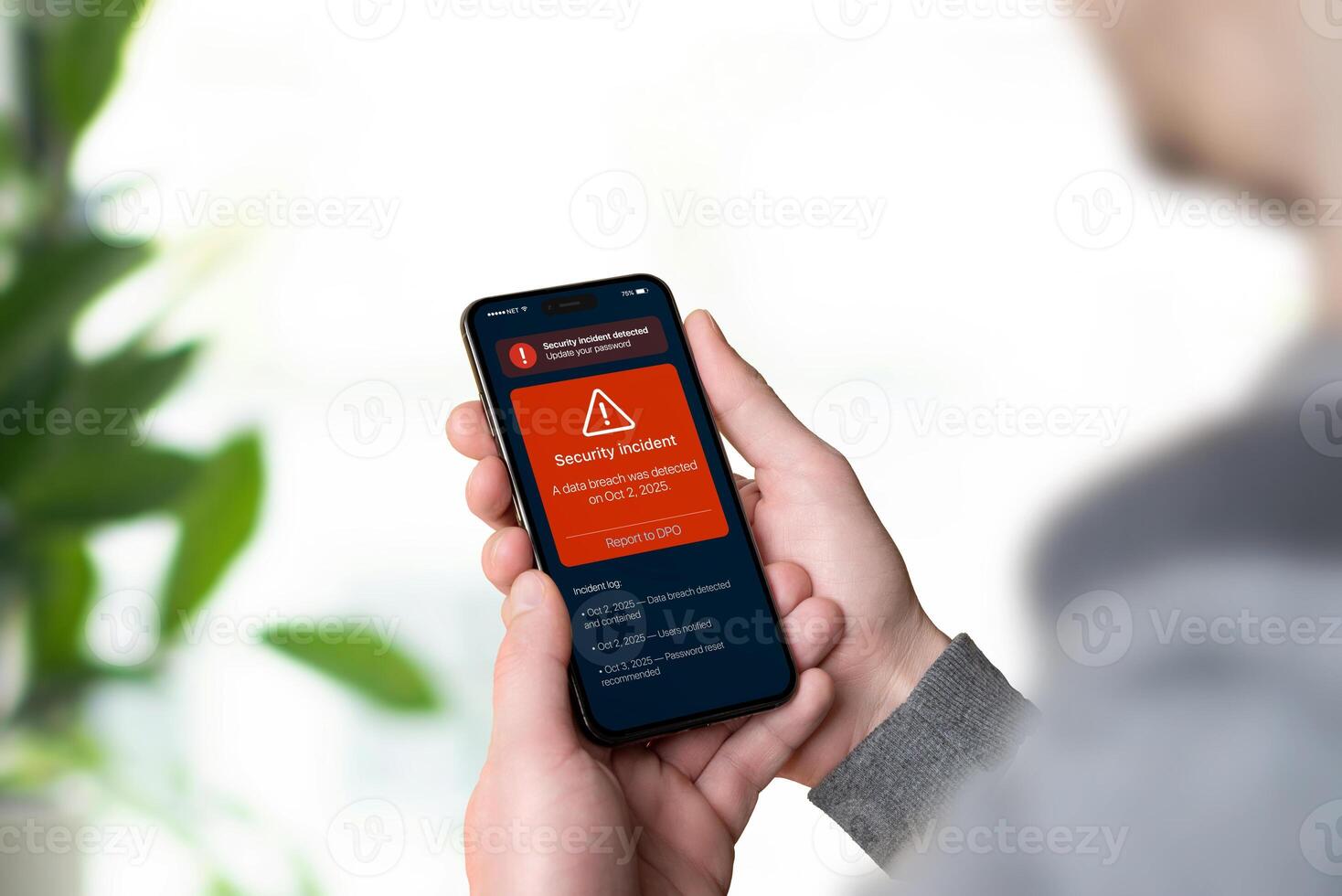 Smartphone displaying red GDPR security alert about data breach with report link to DPO, representing data incident notification and transparency photo