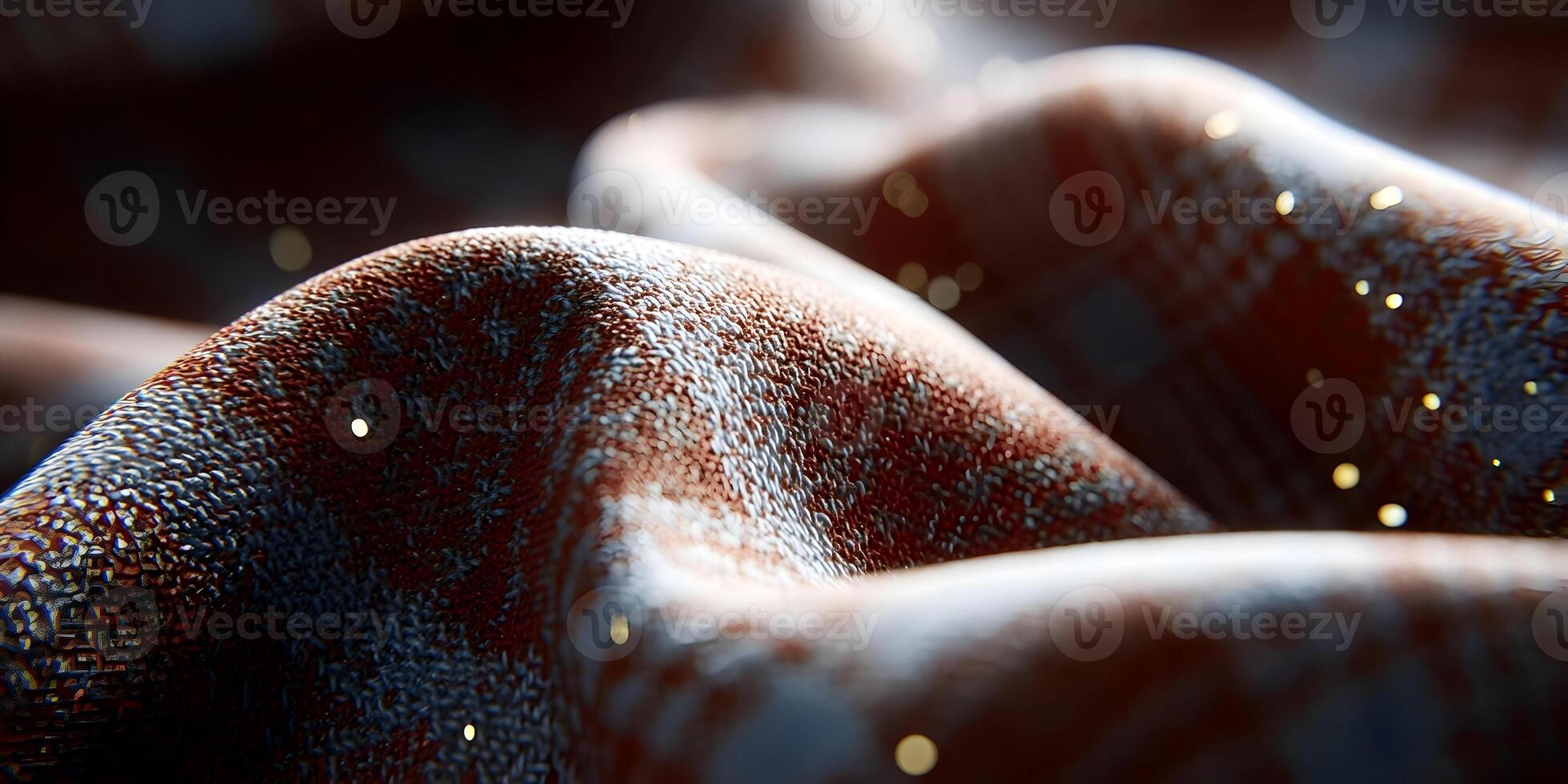 A macro view reveals the intricate texture of a knitted fabric with warm red and dark blue threads illuminated by sparkling golden bokeh lights photo