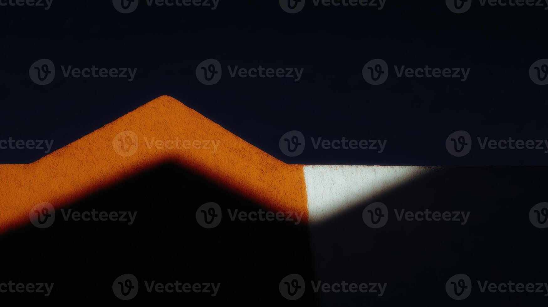 Unique geometric shapes with shadows on a surface photo