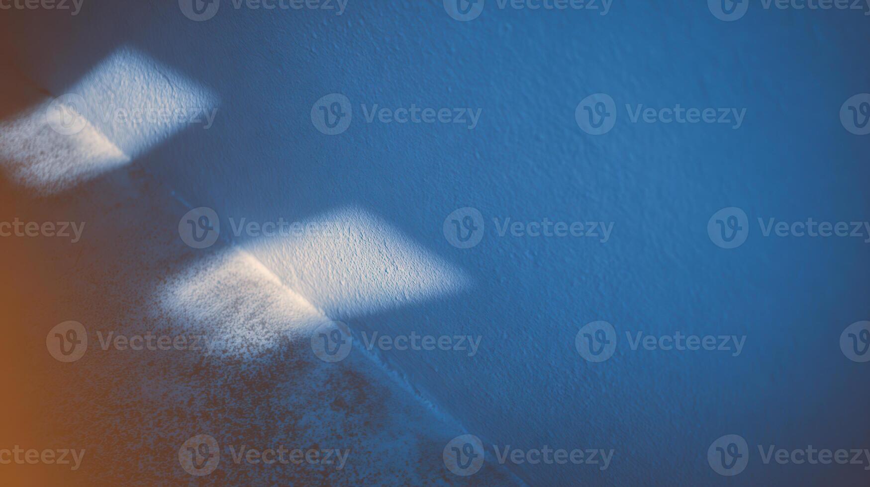 Light patterns create mood on textured wall surface photo