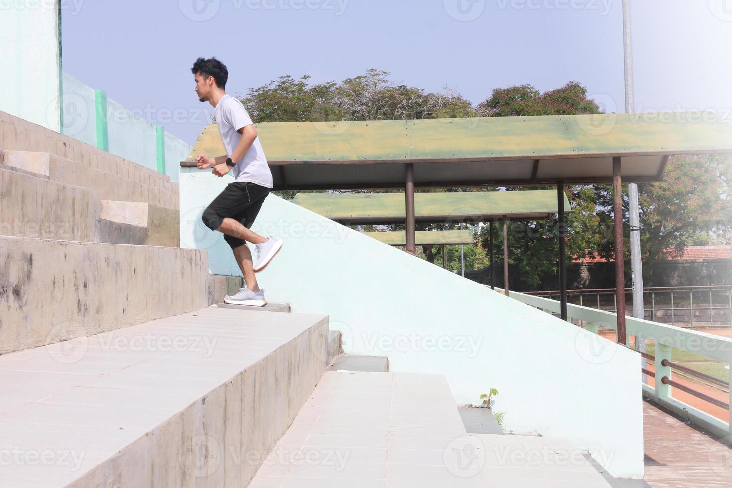 A man is running up a set of stairs. Concept of determination and physical, exertion, photo