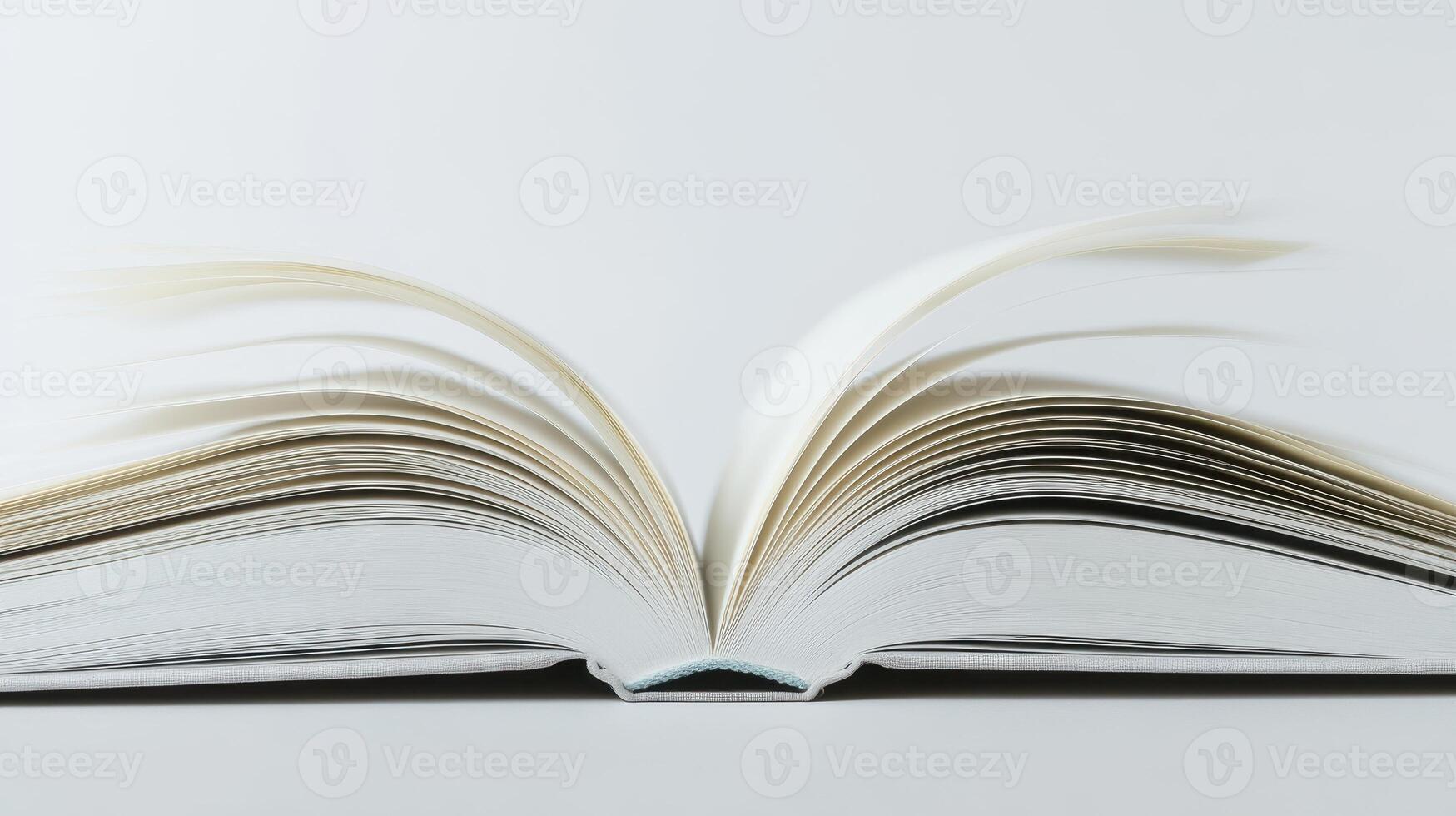 Open Book With White Pages Lying on a Neutral Surface photo