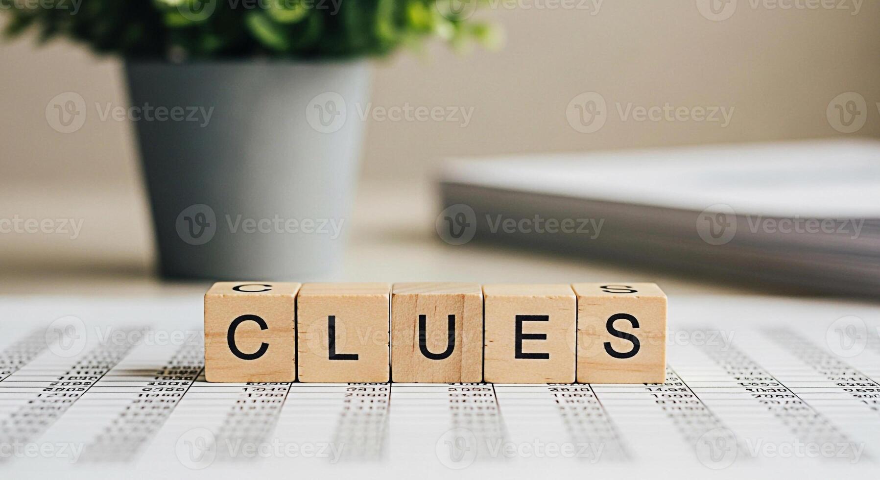Wooden blocks spelling CLUES resting on a financial spreadsheet in a bright office symbolizing investigation and problemsolving in business with a sense of mystery and analytical thinking photo