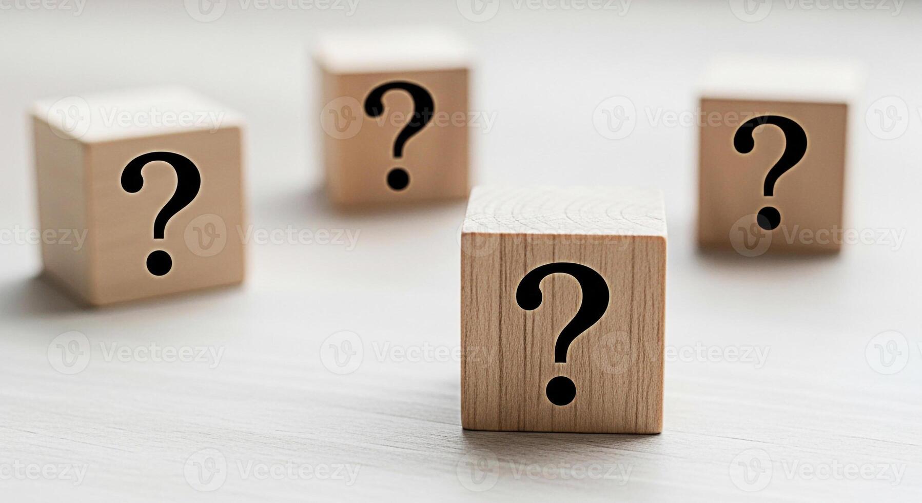 Wooden blocks displaying question marks on a white surface symbolizing uncertainty and the search for answers in a clean minimalist setting fostering a sense of curiosity and problemsolving photo