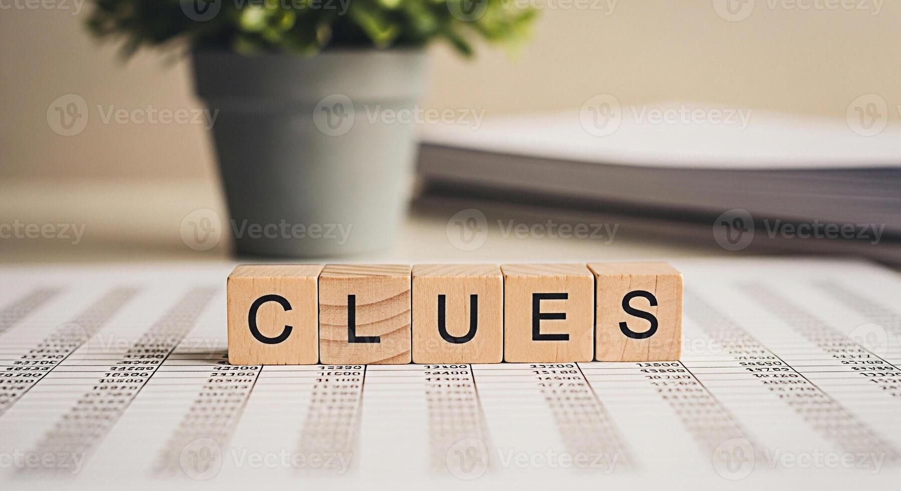Wooden blocks spelling CLUES resting on a financial spreadsheet in a bright office symbolizing investigation problemsolving and the pursuit of answers in business analytics and strategic planning photo