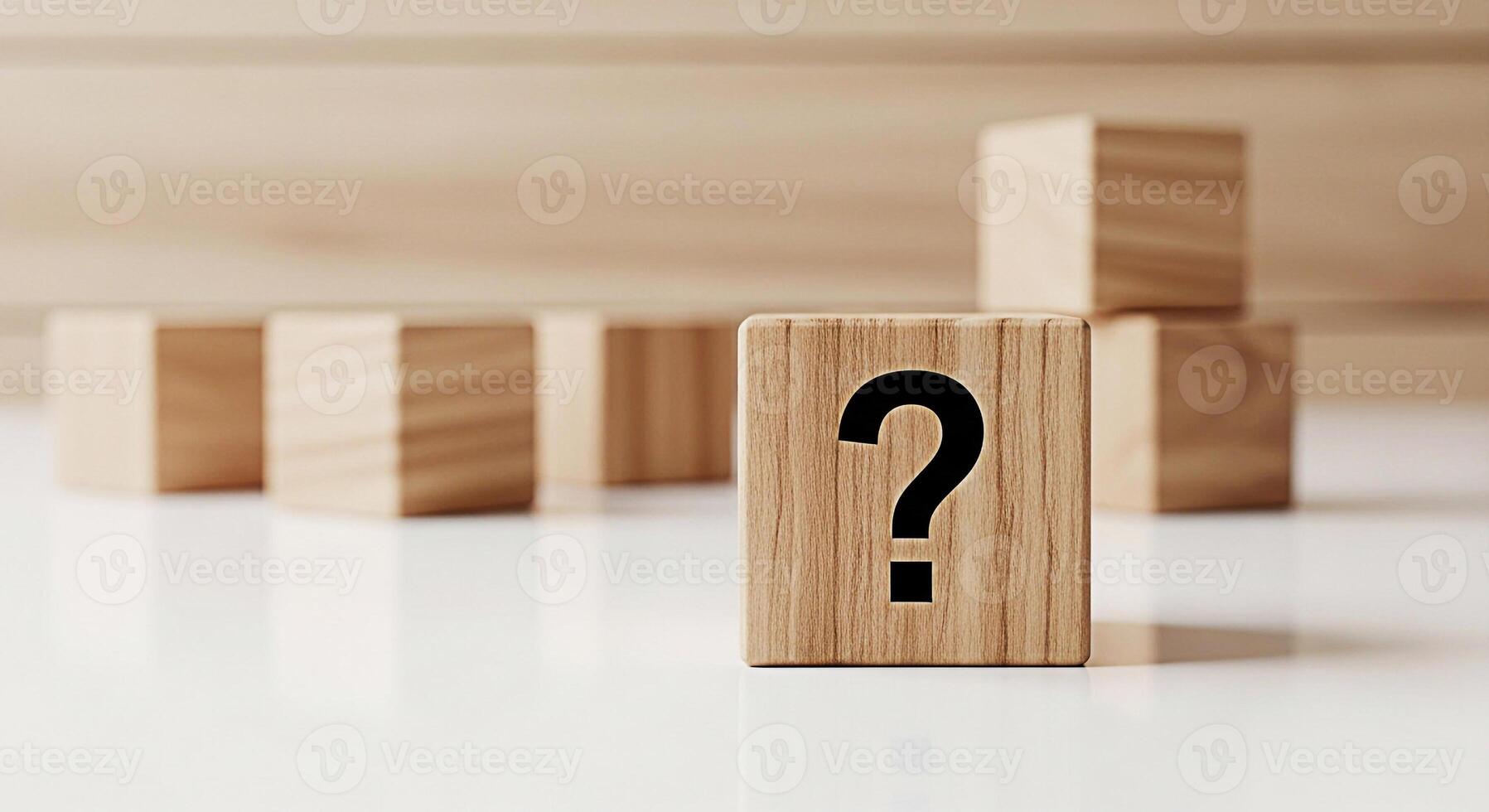 Wooden cube displaying a question mark on a white surface symbolizing uncertainty and the search for answers in a minimalist and conceptual setting evoking curiosity and problemsolving photo