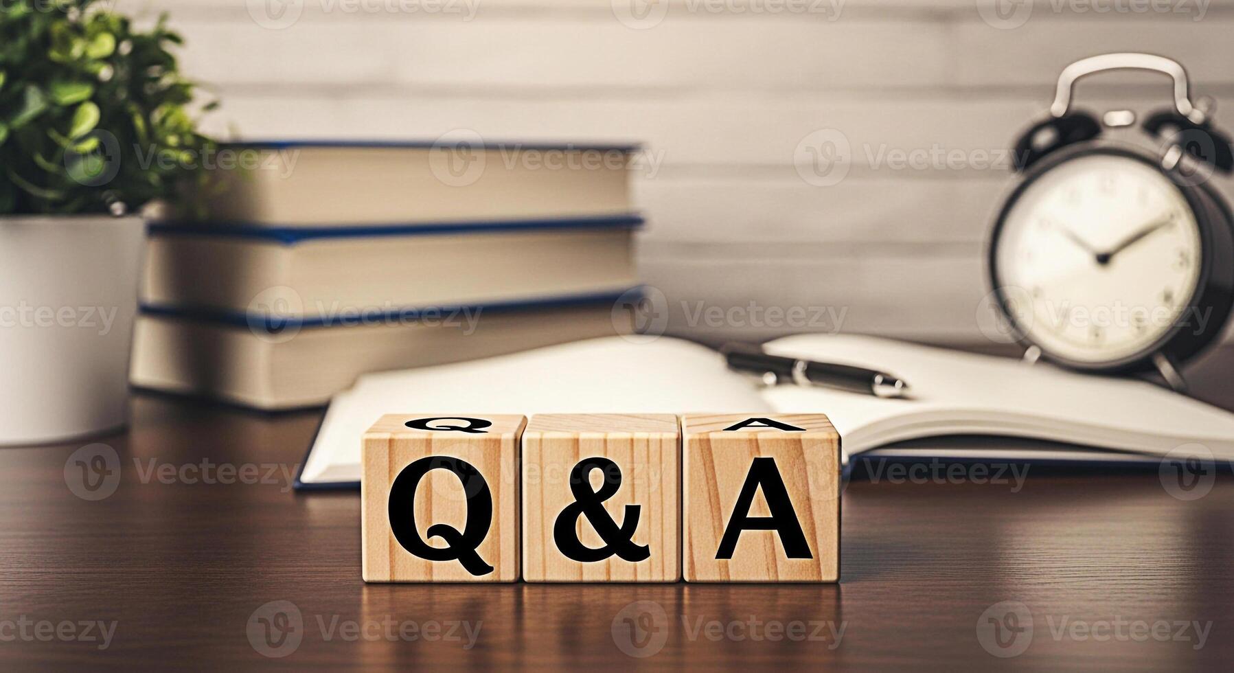 Wooden blocks displaying Q A on a wooden desk with books a notebook a pen and an alarm clock in a cozy office setting representing knowledge learning and problemsolving with a warm and inviting atmosp photo