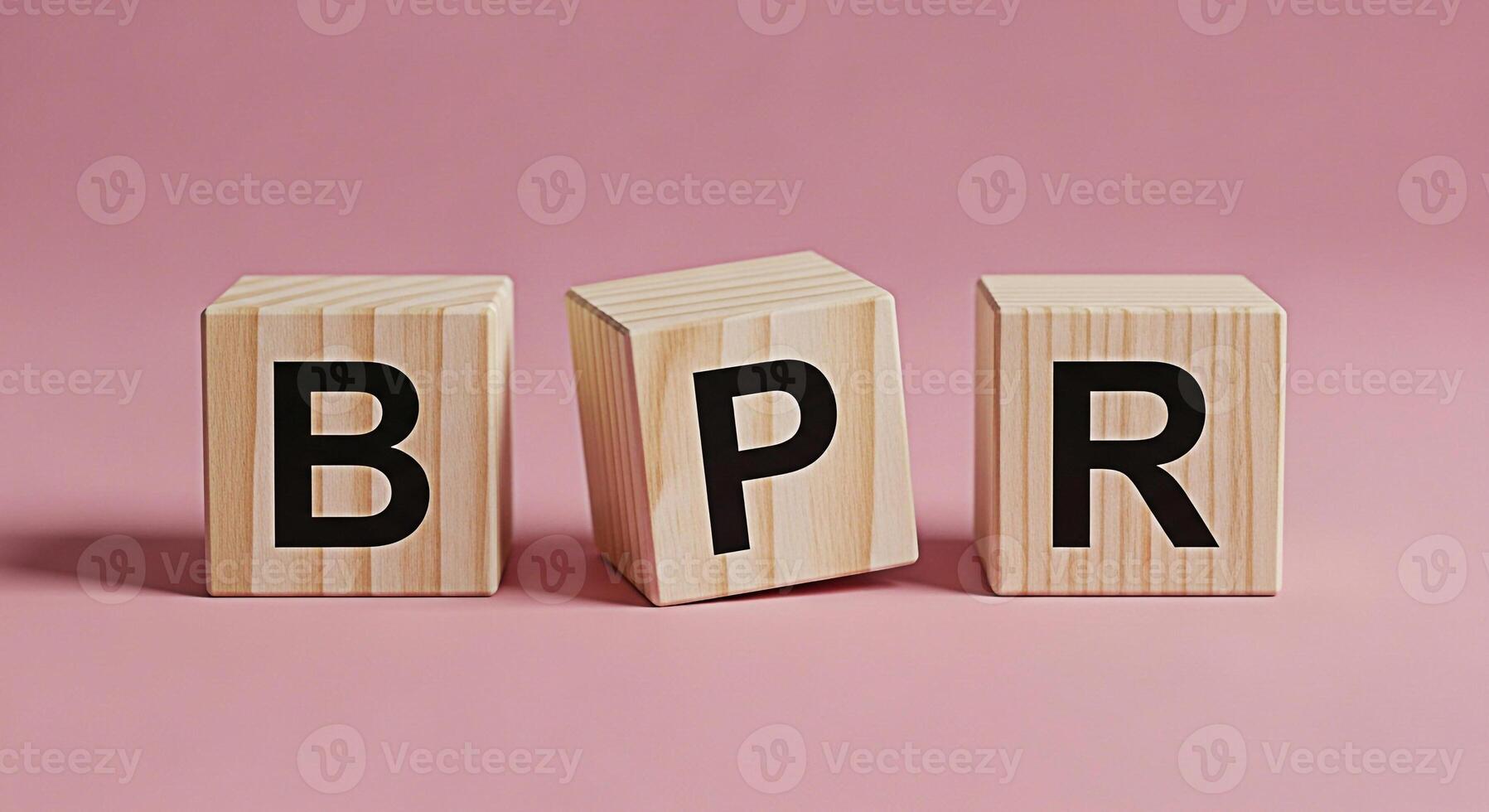 Wooden blocks displaying BPR on a pink surface symbolizing Business Process Reengineering highlighting efficiency and optimization in a minimalist and modern setting conveying a message of strategic i photo