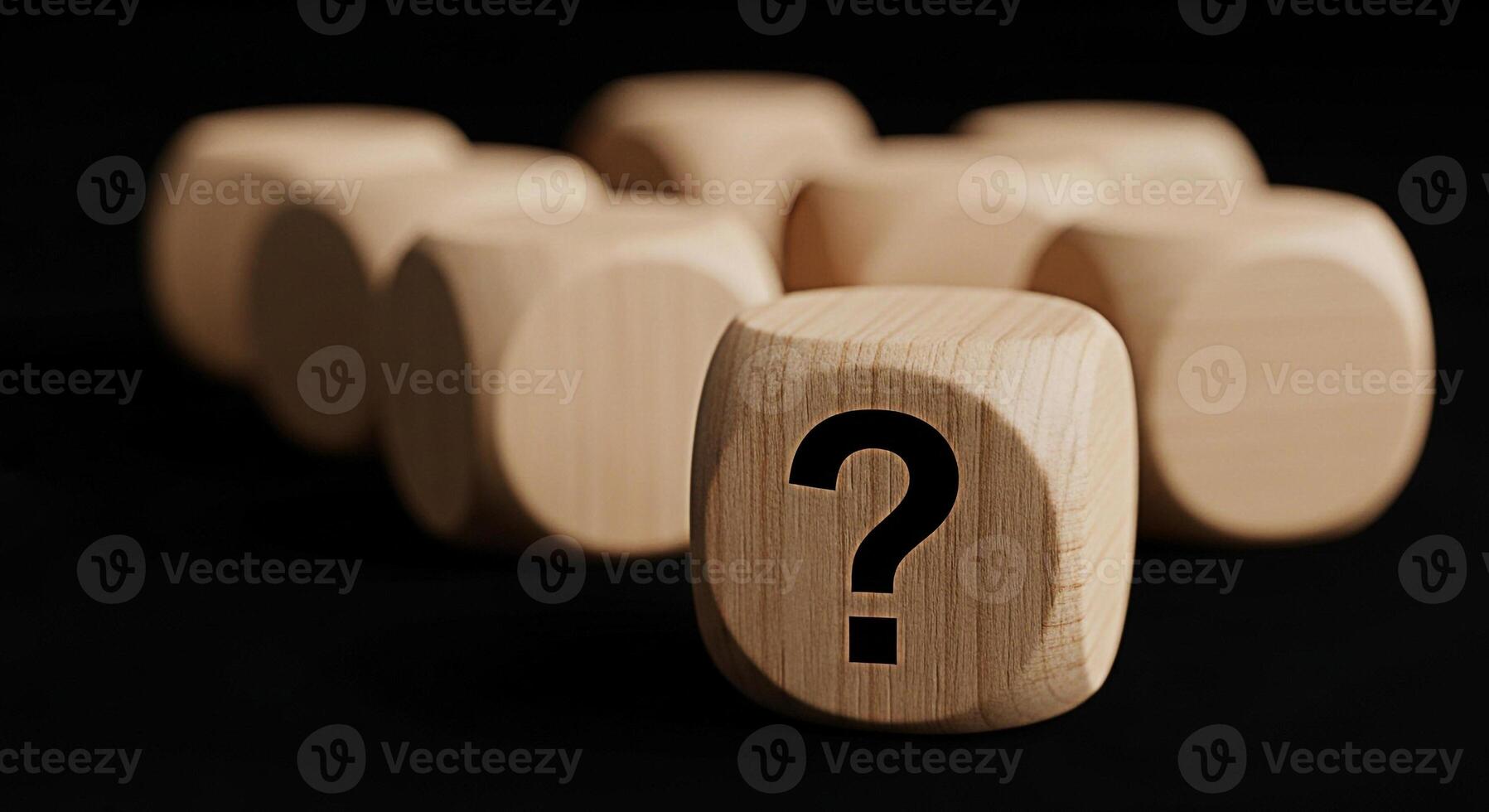Wooden dice displaying a question mark symbol in a dark studio setting representing uncertainty decisions and the need for answers in business and personal life creating a sense of mystery photo