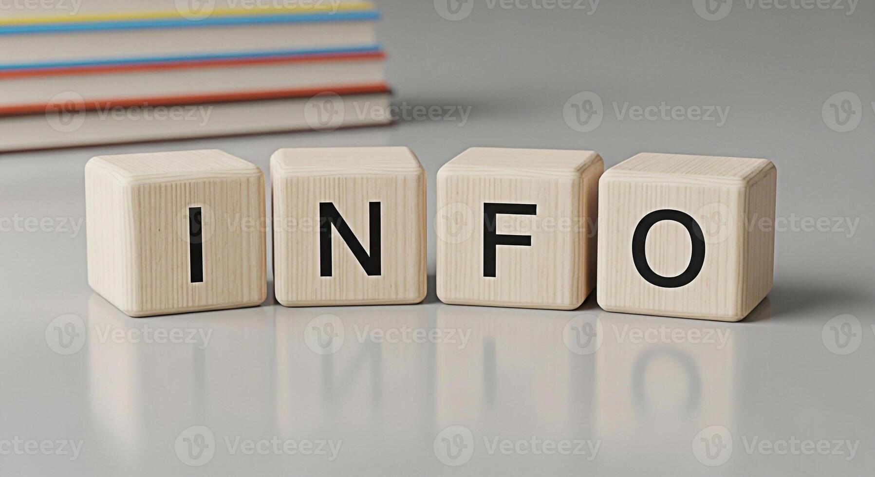 Wooden blocks spelling INFO on a gray surface with books in the background conveying knowledge and information in a clean educational setting ideal for learning and reference materials photo