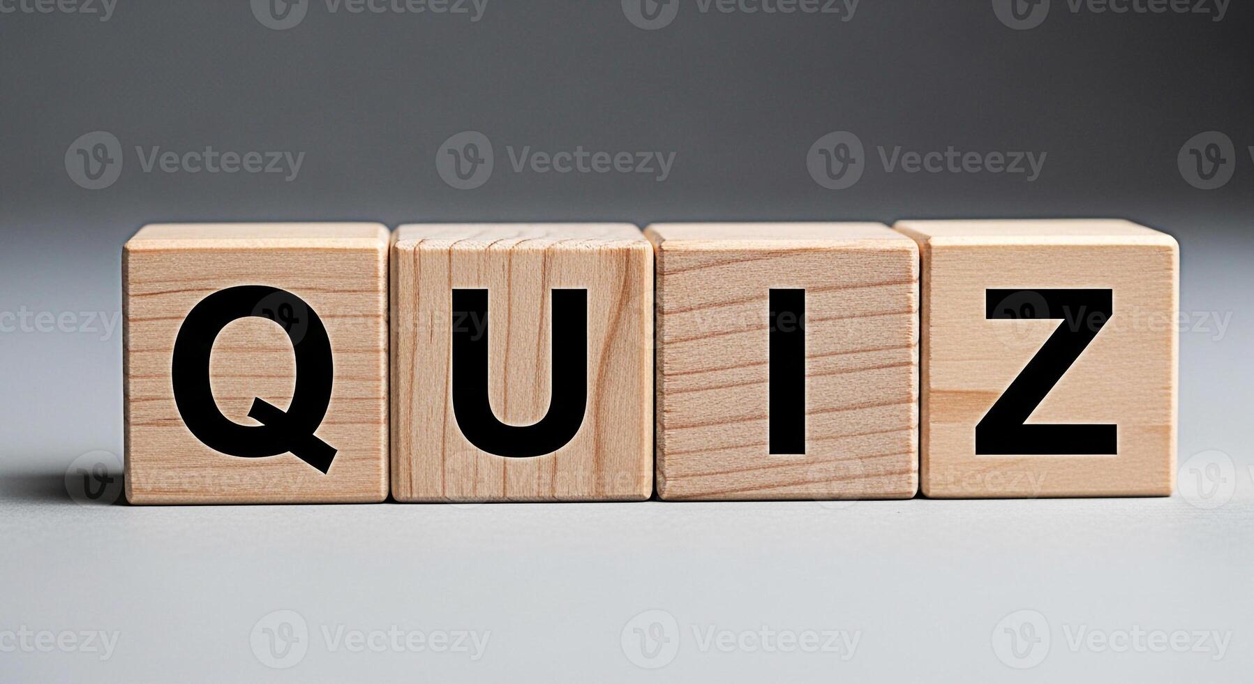 Wooden blocks spelling out QUIZ on a neutral surface representing knowledge testing and learning in an educational setting creating a mood of challenge and intellectual curiosity photo
