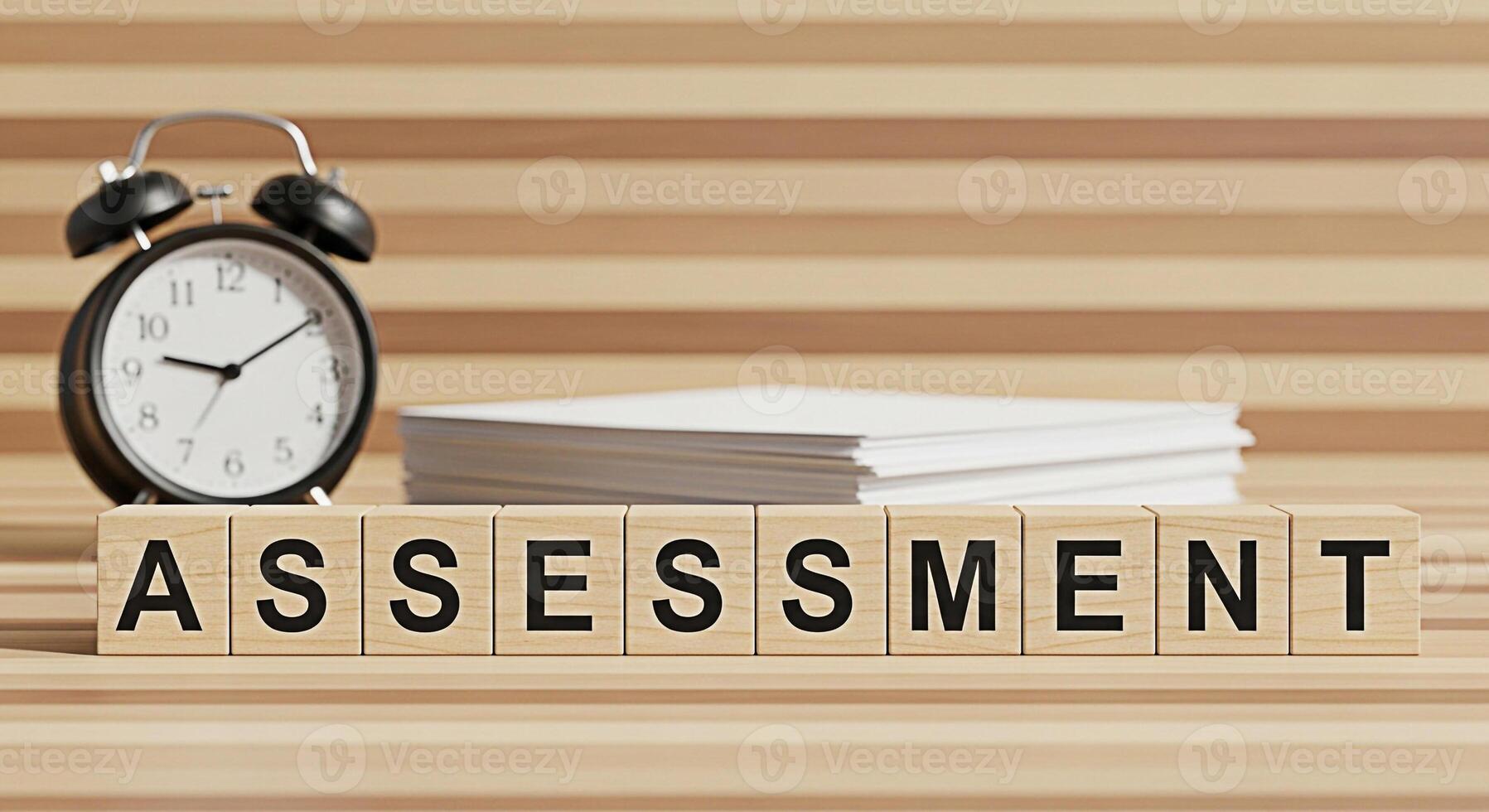 Wooden blocks spelling Assessment with a clock and stack of papers on a wooden surface representing deadlines and evaluation in a neutral professional setting suggesting importance and time management photo