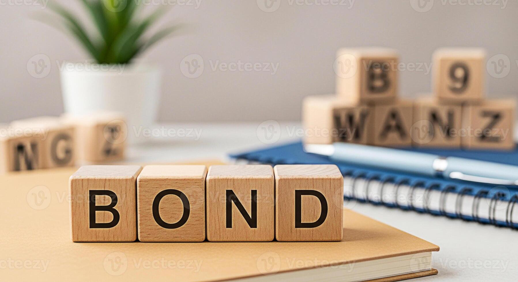 Wooden blocks spelling BOND resting on a notebook in a bright modern office setting symbolizing financial security investment strategy and wealth management with a focus on stability and longterm grow photo