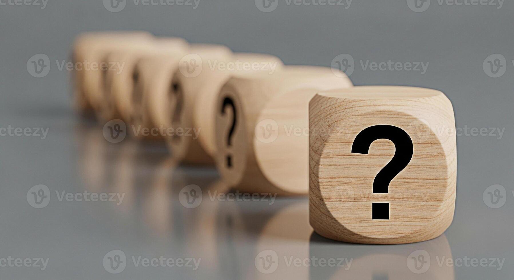 Wooden dice displaying question marks on a gray surface symbolizing uncertainty and the need for answers in business and personal life creating a mood of curiosity and problemsolving photo