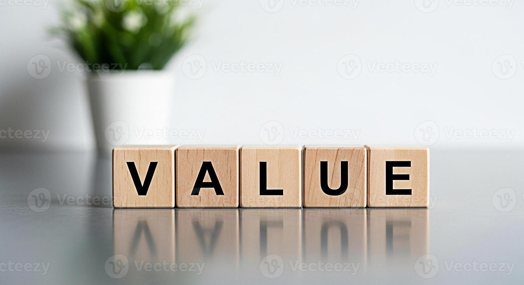 Wooden blocks spelling VALUE on a reflective surface conveying importance and worth in a clean modern environment symbolizing business ethics personal values and financial principles photo