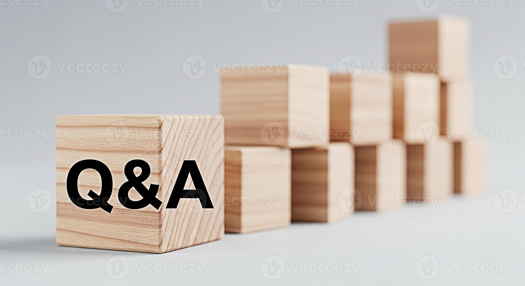 Wooden blocks displaying QA in a minimalist studio setting symbolizing knowledge learning and problemsolving with a focus on questions and answers fostering a sense of clarity and understanding photo